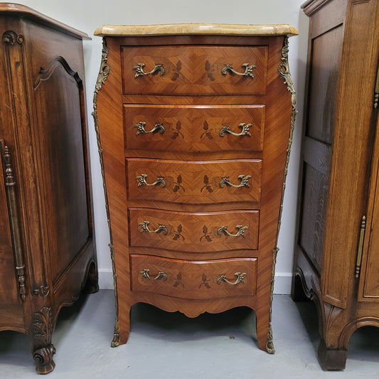 Stunning chest of five drawers with a marble top and decorative marquetry inlay. From circa 1930's this pieces has been fully restored. 