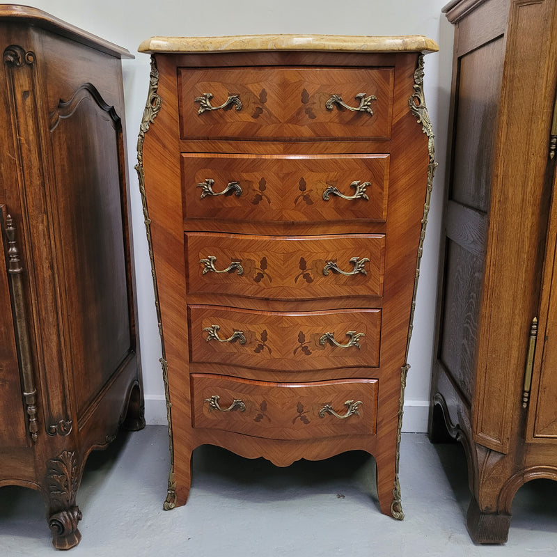 Stunning chest of five drawers with a marble top and decorative marquetry inlay. From circa 1930's this pieces has been fully restored.