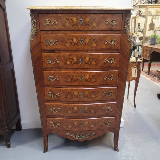 An amazing 1930's Louis XV style walnut and kingwood marquetry inlaid marble top semainier chest with seven generous sized drawers. This beautiful piece has been fully restored and is in great condition.