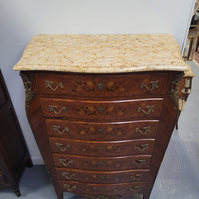 An amazing 1930's Louis XV style walnut and kingwood marquetry inlaid marble top semainier chest with seven generous sized drawers. This beautiful piece has been fully restored and is in great condition.