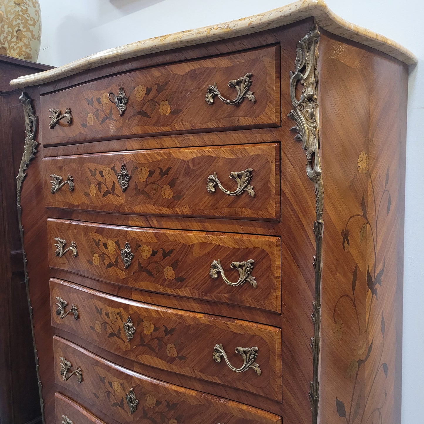 An amazing 1930's Louis XV style walnut and kingwood marquetry inlaid marble top semainier chest with seven generous sized drawers. This beautiful piece has been fully restored and is in great condition.
