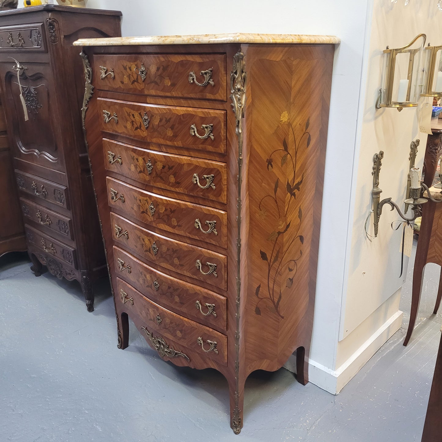 An amazing 1930's Louis XV style walnut and kingwood marquetry inlaid marble top semainier chest with seven generous sized drawers. This beautiful piece has been fully restored and is in great condition.