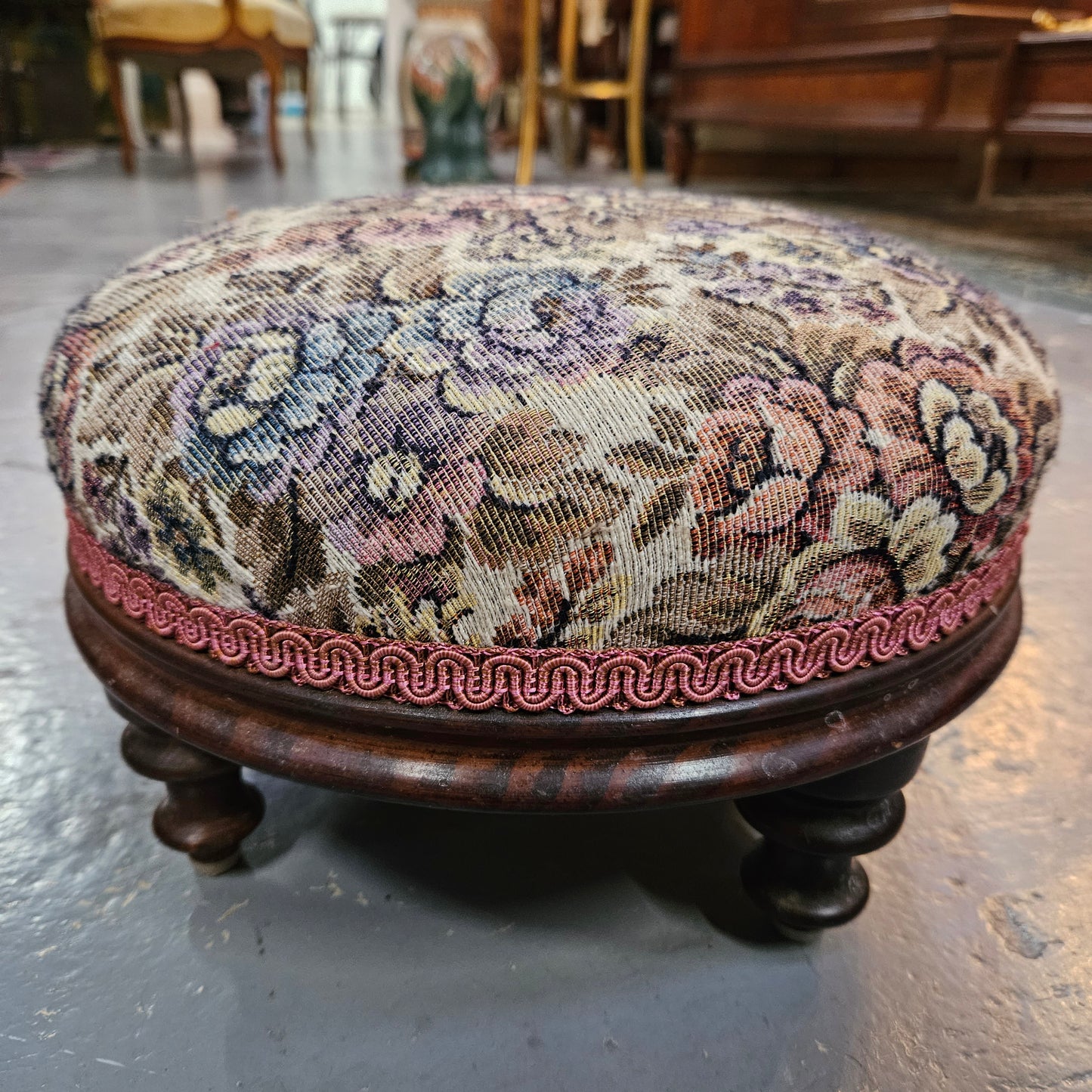 Lovely Victorian nicely upholstered footstool. It is in good original condition. Please see photos as they form part of the description.