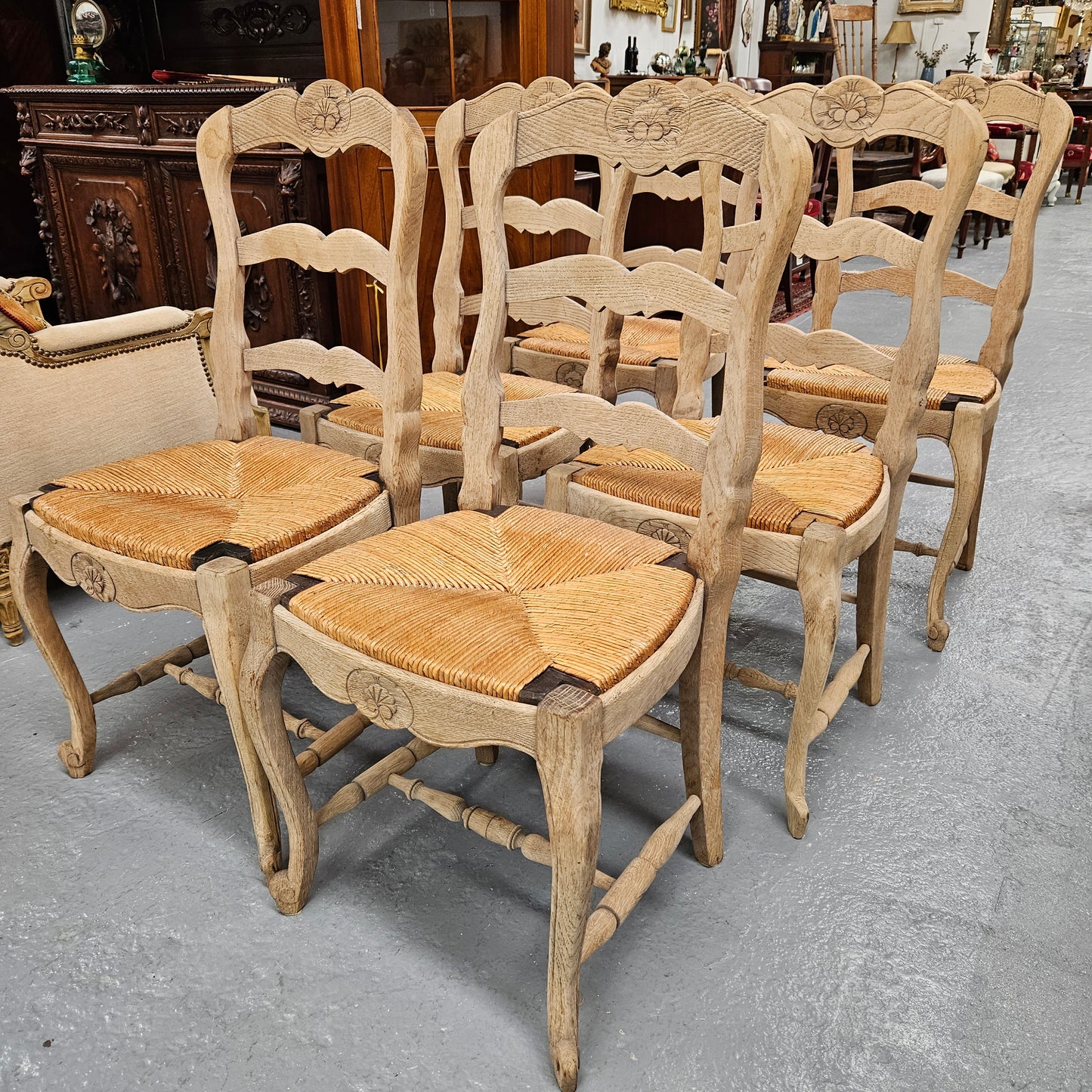 Hard to find set of six striped French Oak rush seat dining chairs. They are in good original detailed condition and have been re-glued. Sourced from France. Please see photos as they form part of the description.