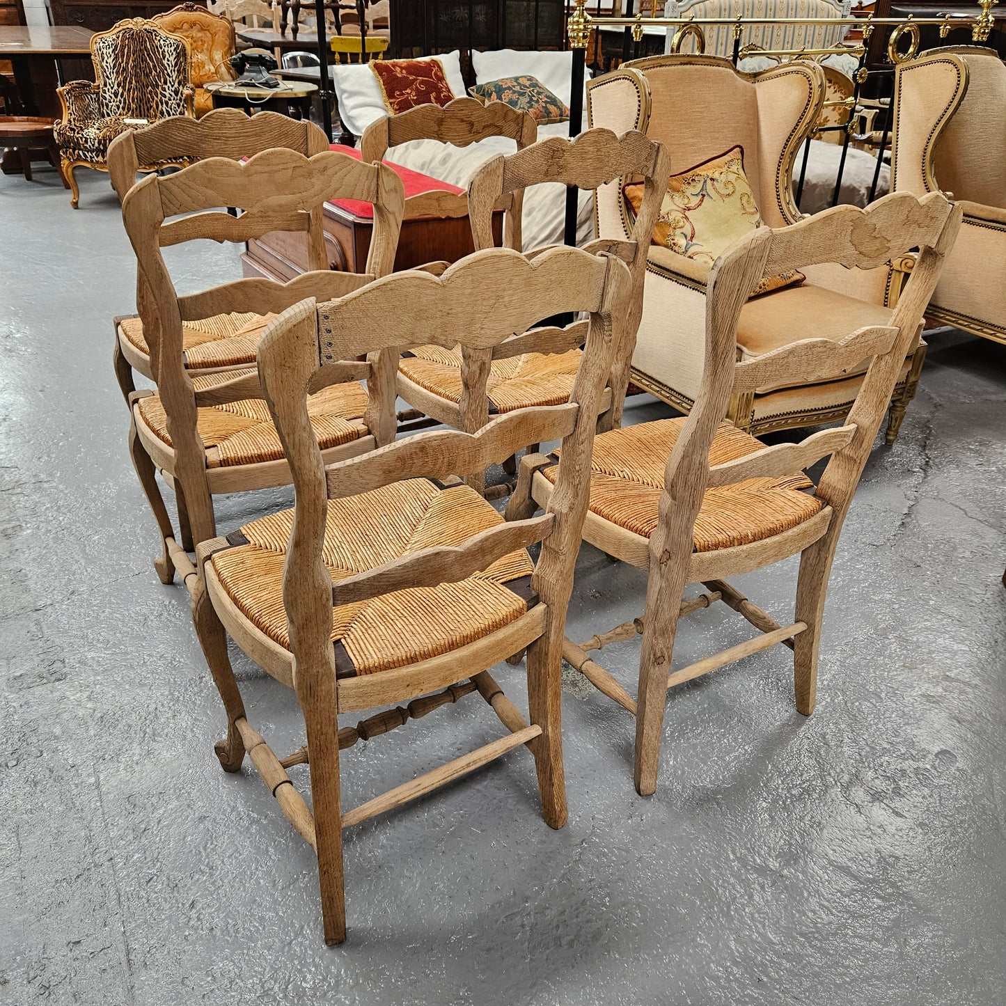 Hard to find set of six striped French Oak rush seat dining chairs. They are in good original detailed condition and have been re-glued. Sourced from France. Please see photos as they form part of the description.