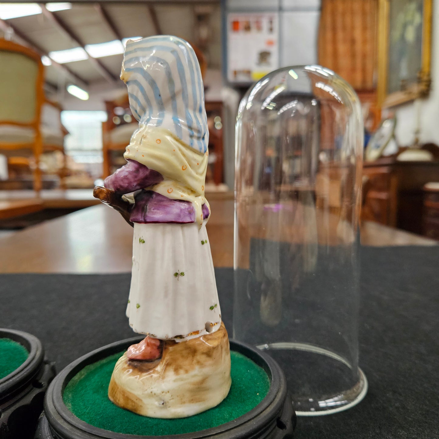 Pair Late Victorian Austrian figures displayed in glass domes