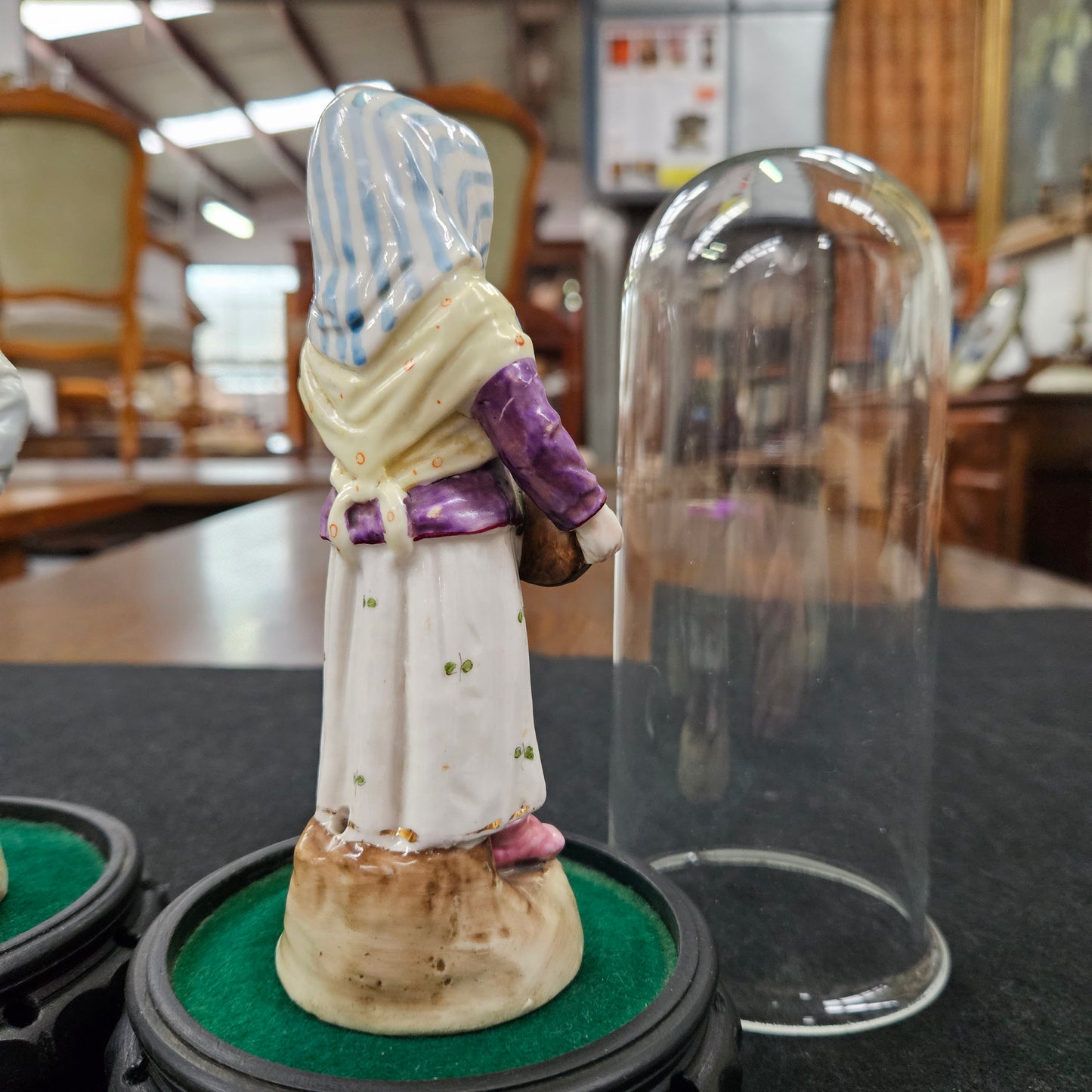 Pair Late Victorian Austrian figures displayed in glass domes