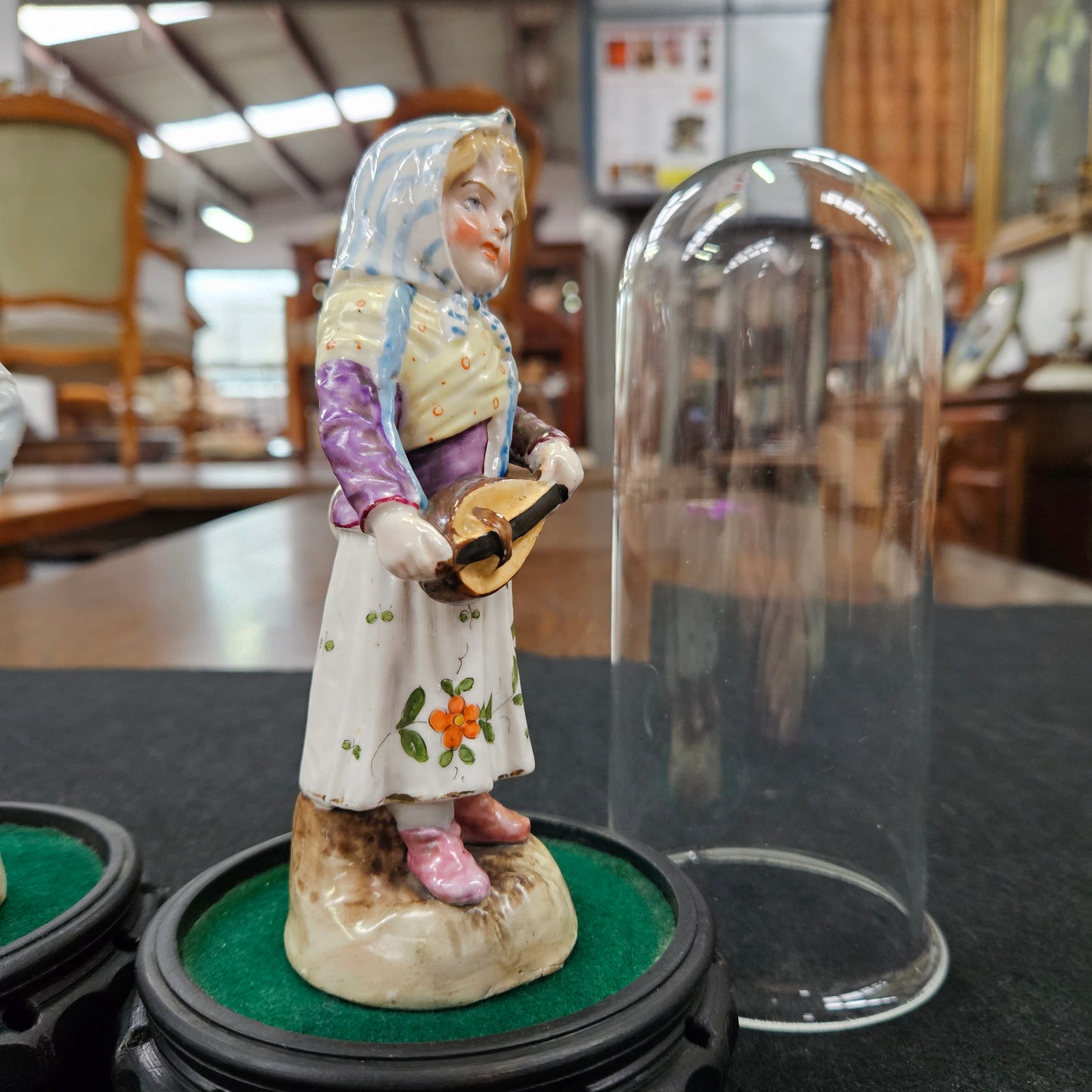 Pair Late Victorian Austrian figures displayed in glass domes