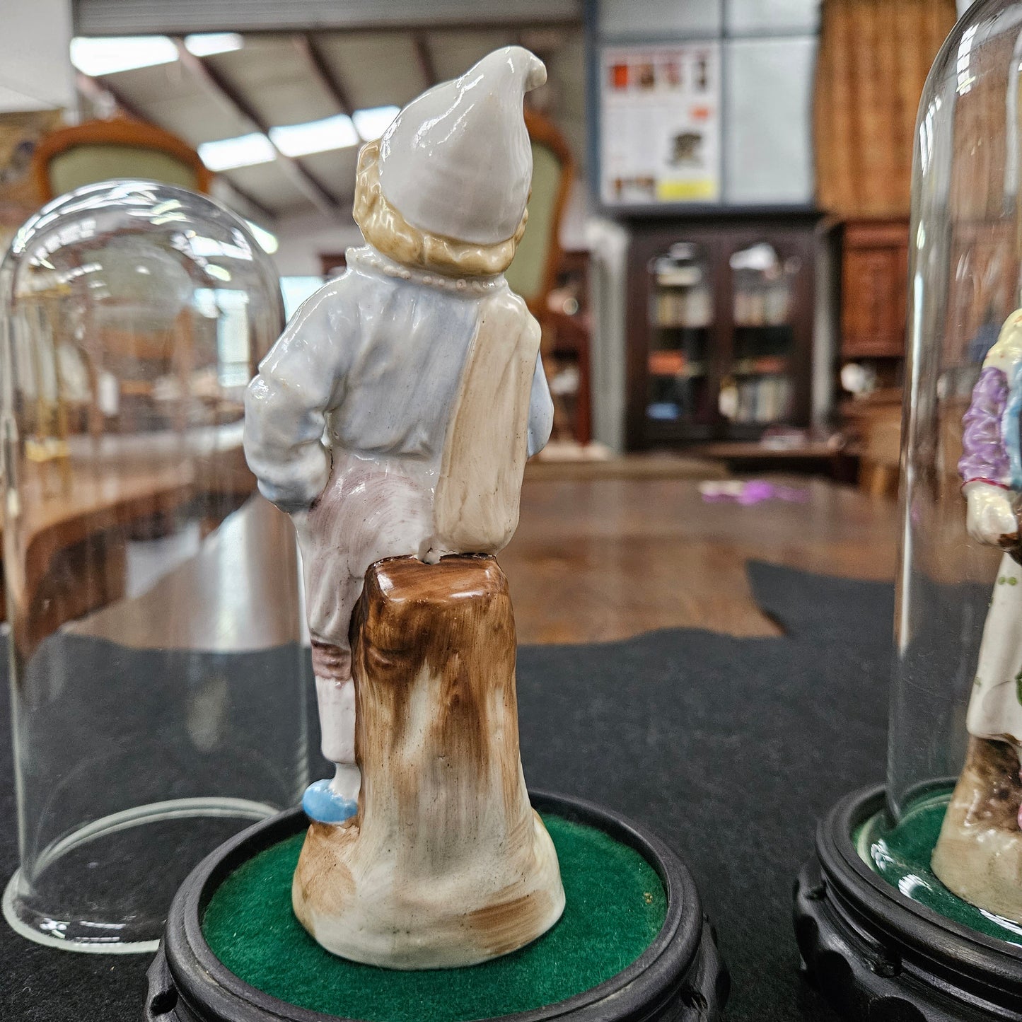 Pair Late Victorian Austrian figures displayed in glass domes