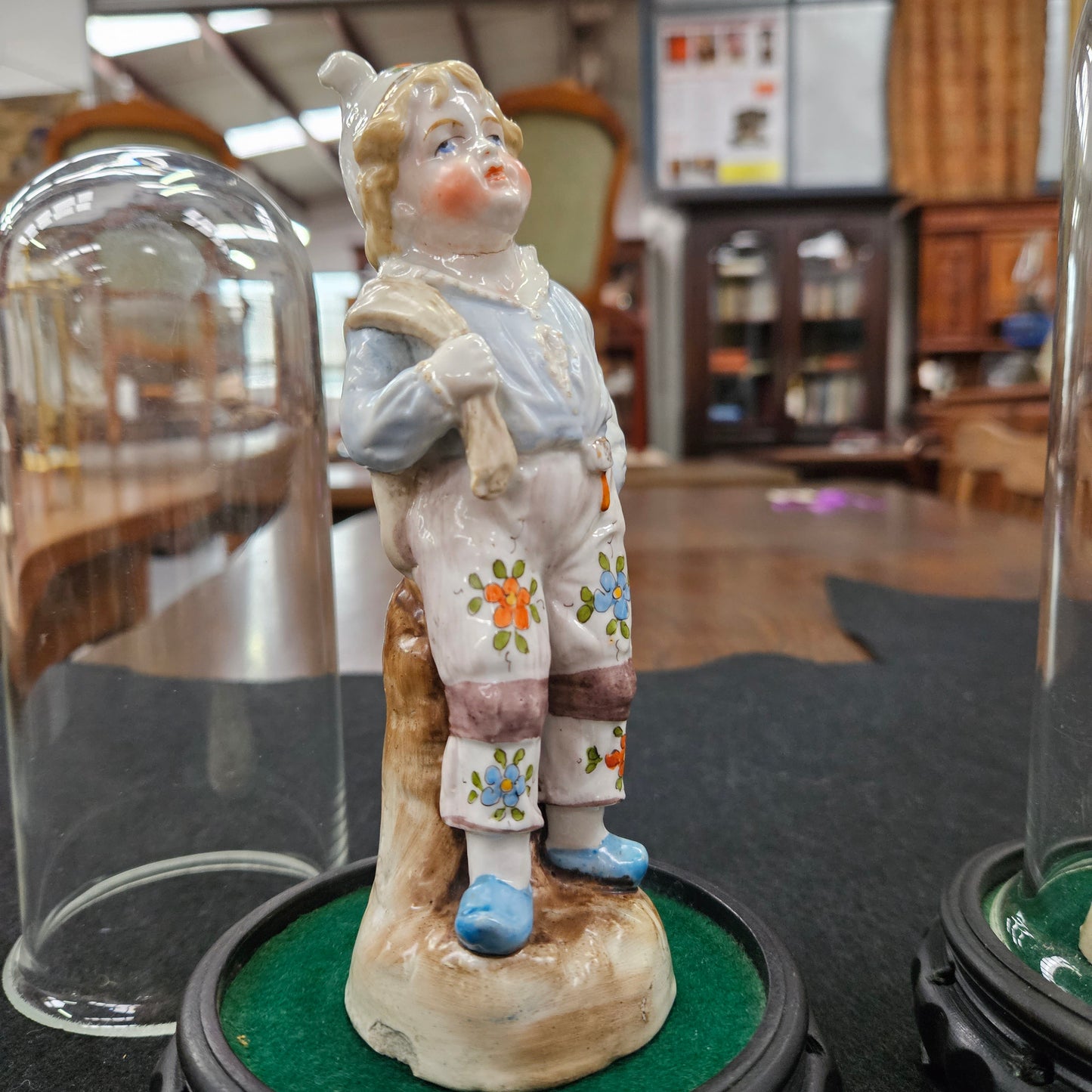 Pair Late Victorian Austrian figures displayed in glass domes