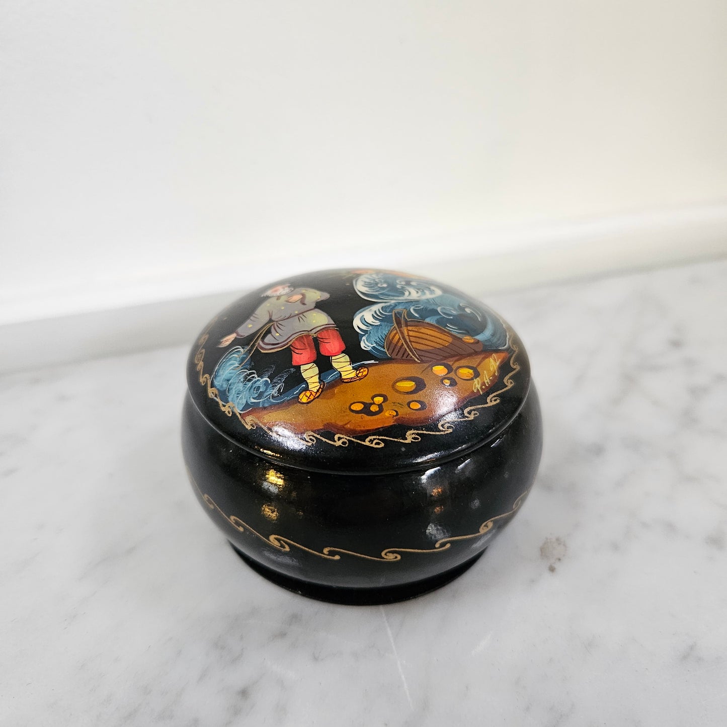 Vintage hand painted Russian trinket box depicting man and boat. In good original condition, please view photos as they help form part of the description.