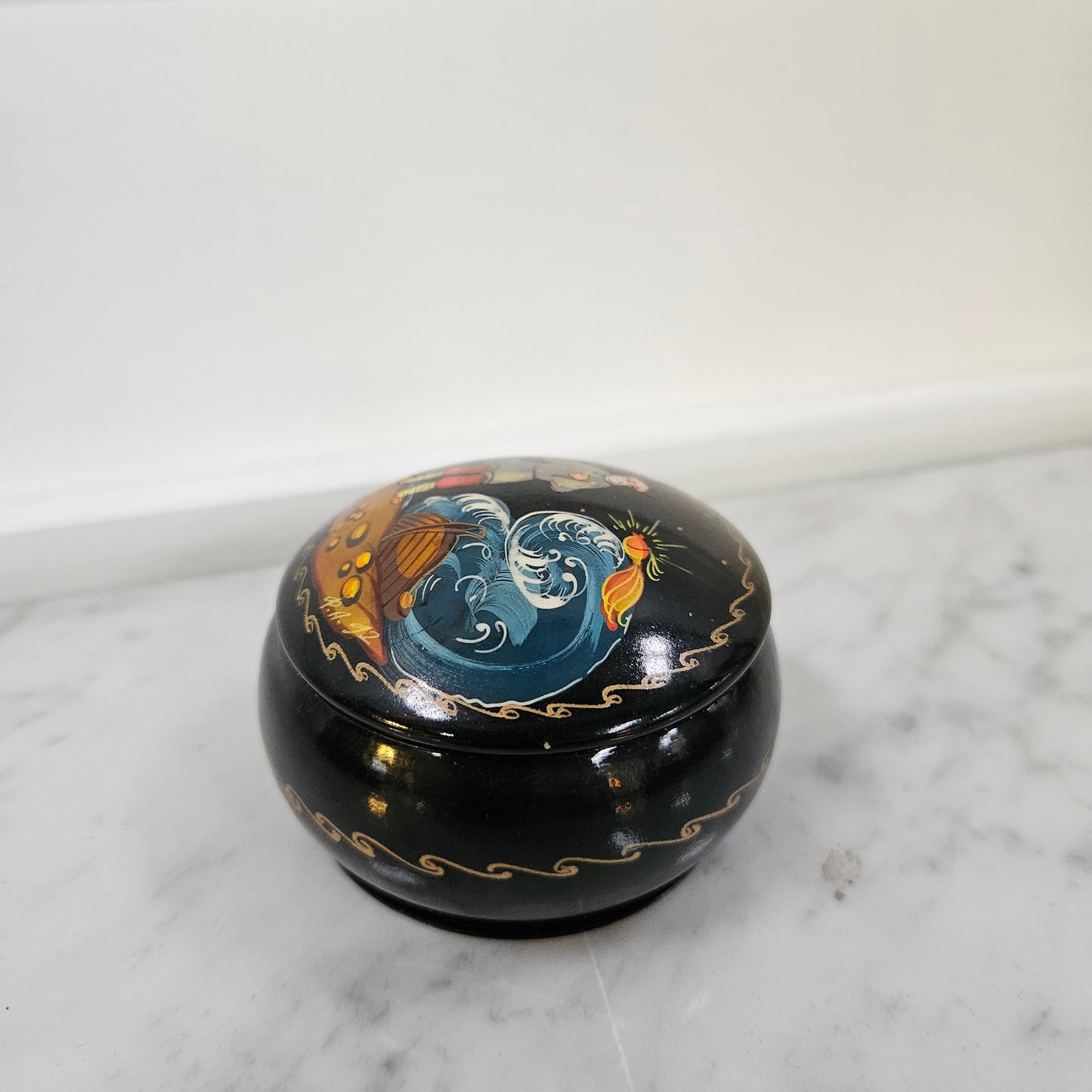 Vintage hand painted Russian trinket box depicting man and boat. In good original condition, please view photos as they help form part of the description.