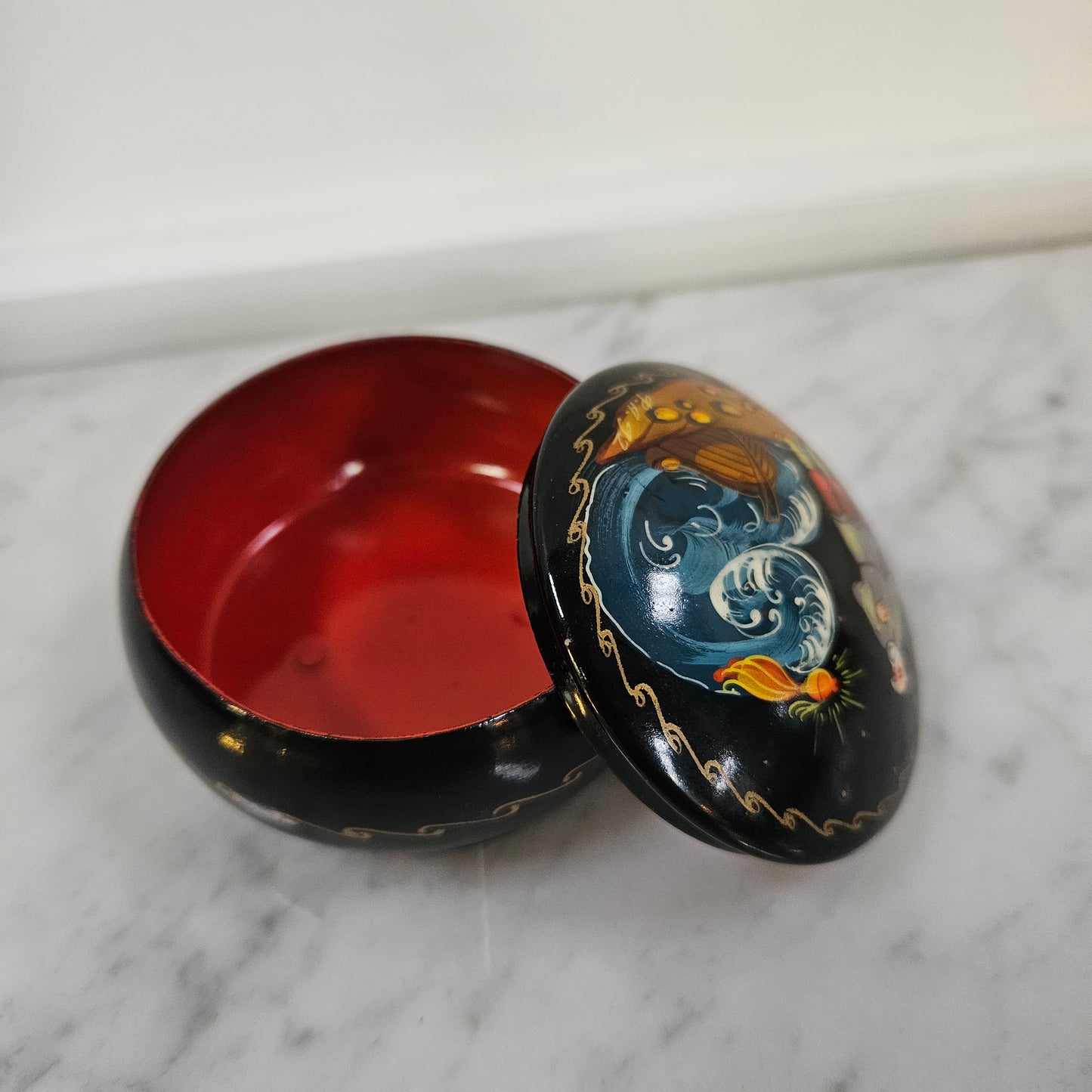 Vintage hand painted Russian trinket box depicting man and boat. In good original condition, please view photos as they help form part of the description.
