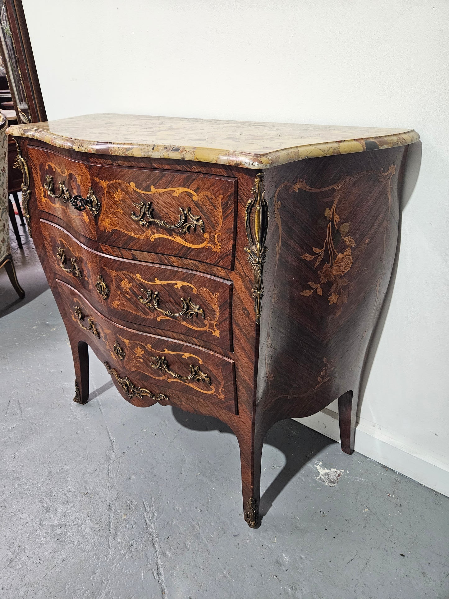 Stunning Antique rosewood three drawer marquetry inlaid marble top commode with ormolu mounts. It is in great original detailed condition. Please see photos as they form part of the description.