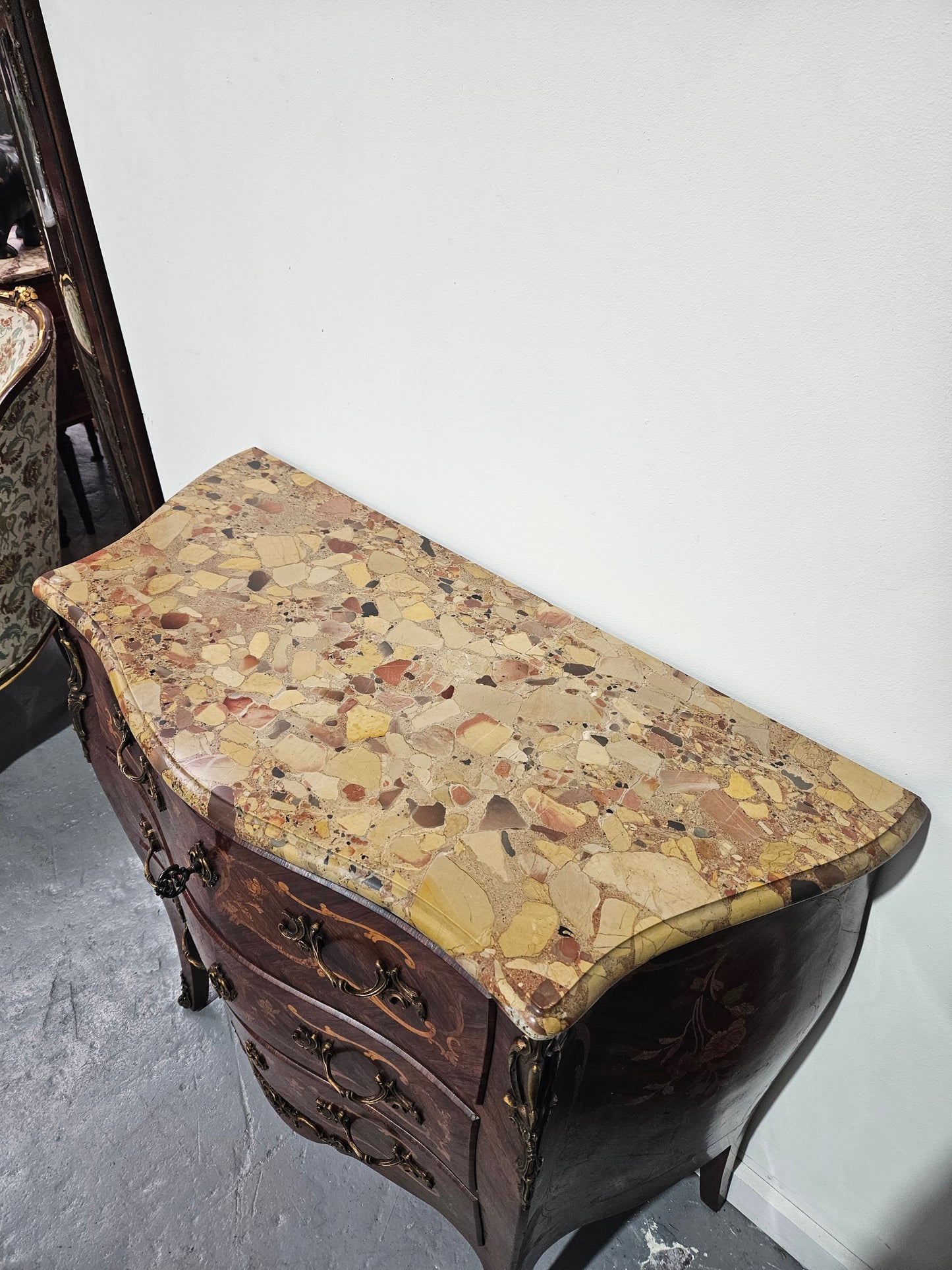 Stunning Antique rosewood three drawer marquetry inlaid marble top commode with ormolu mounts. It is in great original detailed condition. Please see photos as they form part of the description.
