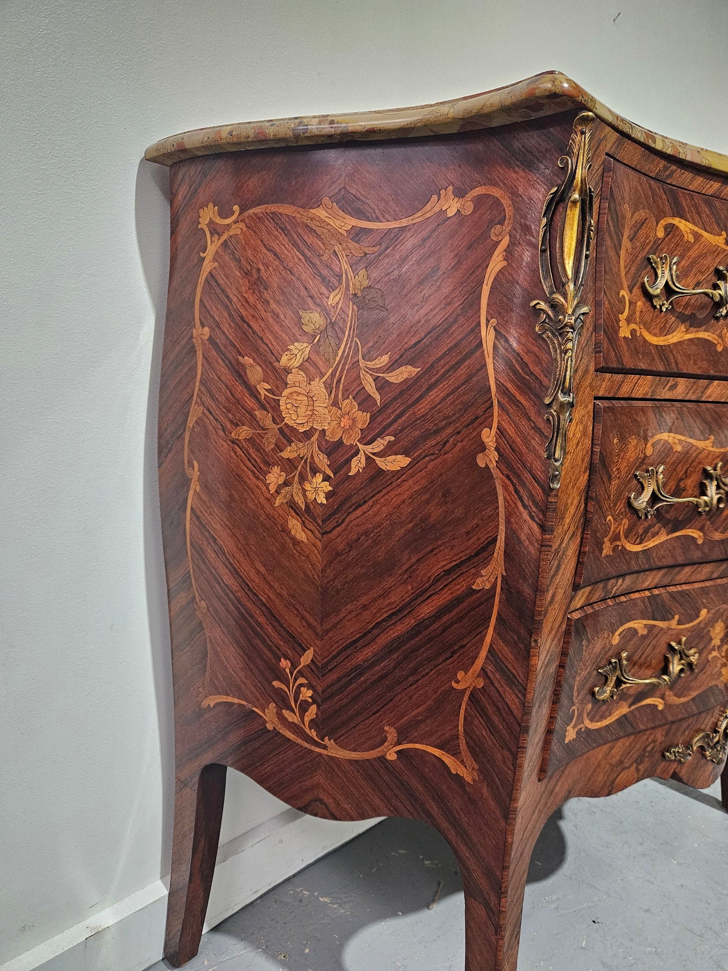 Stunning Antique rosewood three drawer marquetry inlaid marble top commode with ormolu mounts. It is in great original detailed condition. Please see photos as they form part of the description.