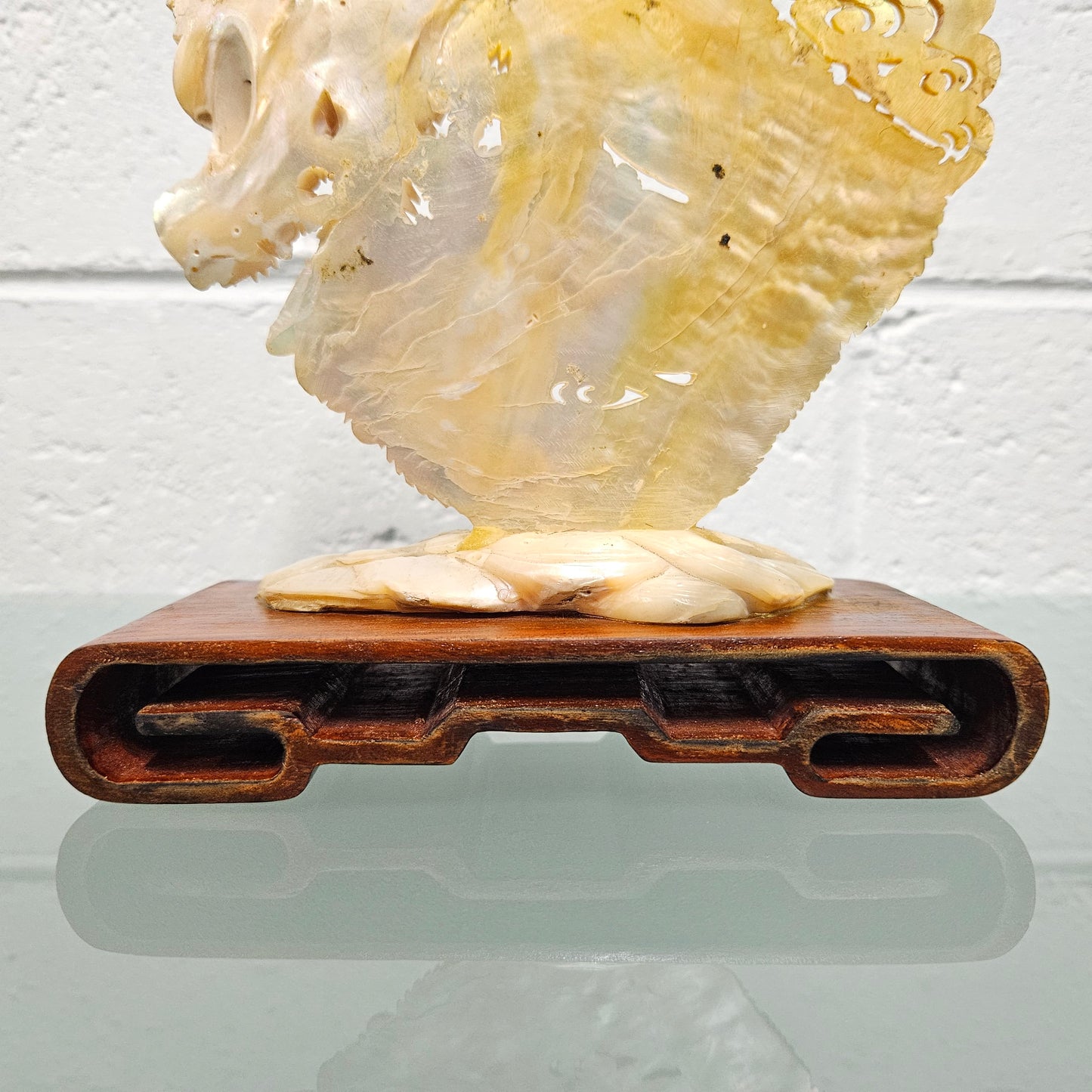 Stunning Dragon Carving on Mother of Pearl. Mounted on Wooden Stand. Please see photos as they form part of the description.