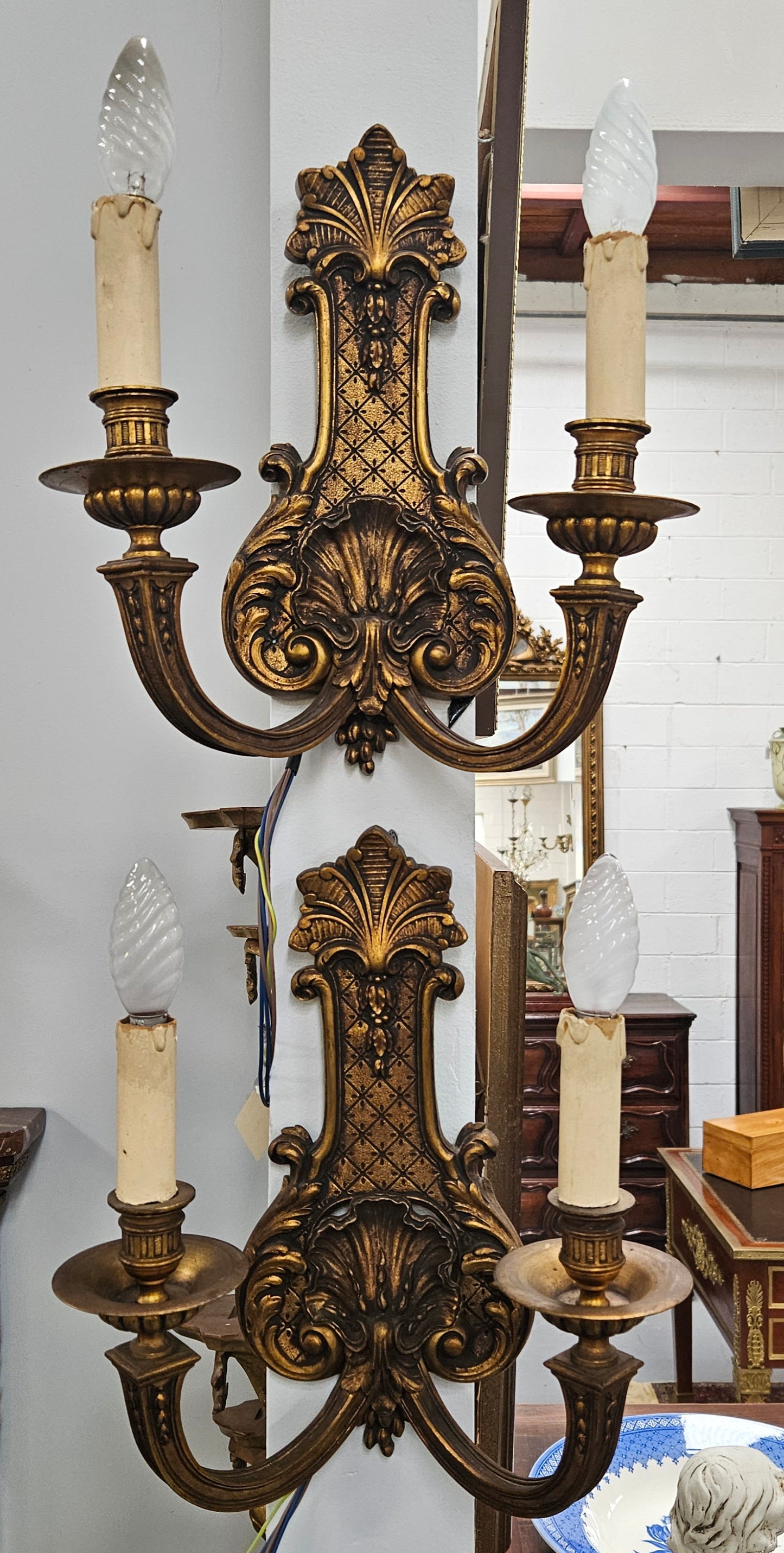 Lovely pair of Louis XV style bronze antique wall sconces lights. They are stunning details and have been rewired to Australian standards. These are in excellent original condition. Please view photos as they form part of the description.