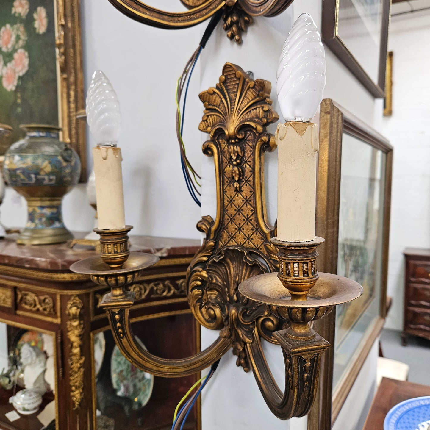 Lovely pair of Louis XV style bronze antique wall sconces lights. They are stunning details and have been rewired to Australian standards. These are in excellent original condition. Please view photos as they form part of the description.