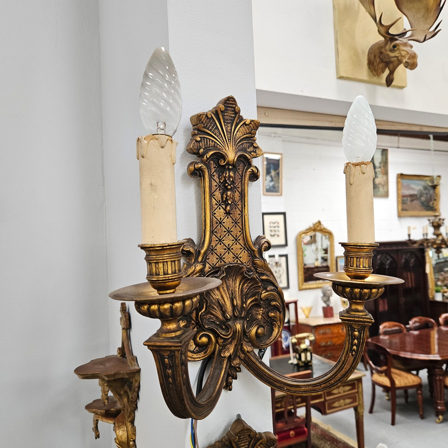 Lovely pair of Louis XV style bronze antique wall sconces lights. They are stunning details and have been rewired to Australian standards. These are in excellent original condition. Please view photos as they form part of the description.