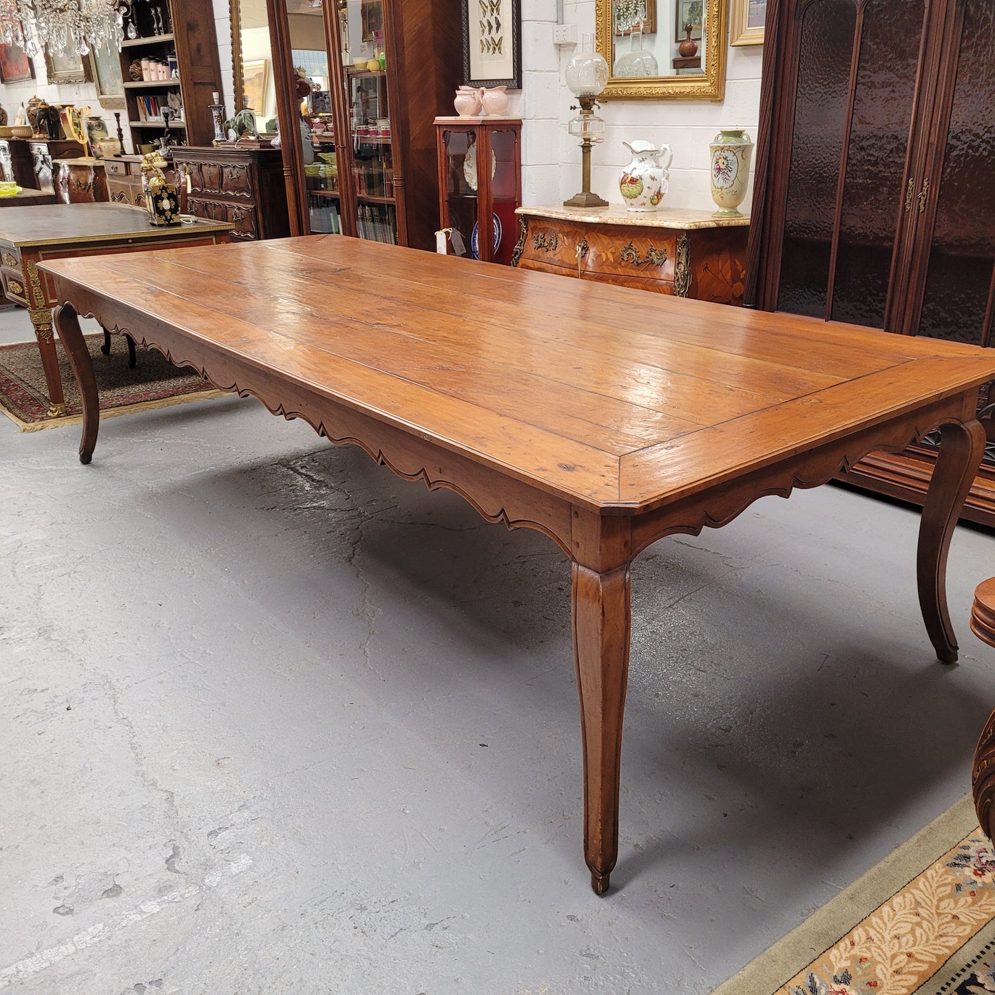Rustic 19th Century French Fruitwood Parisian farmhouse dining table. Sourced from France this amazing hard to find size table can easily sit 12 to 14 people. It is good original detailed condition. Please see photos as they form part of the descript