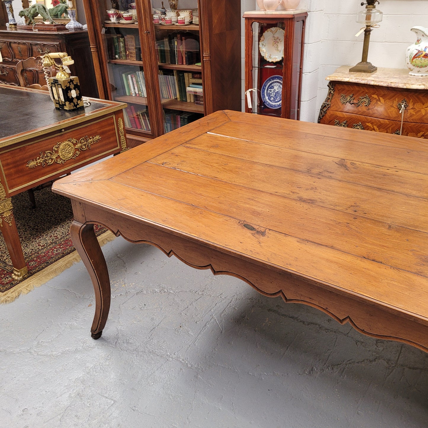 Rustic 19th Century French Fruitwood Parisian farmhouse dining table. Sourced from France this amazing hard to find size table can easily sit 12 to 14 people. It is good original detailed condition. Please see photos as they form part of the descript