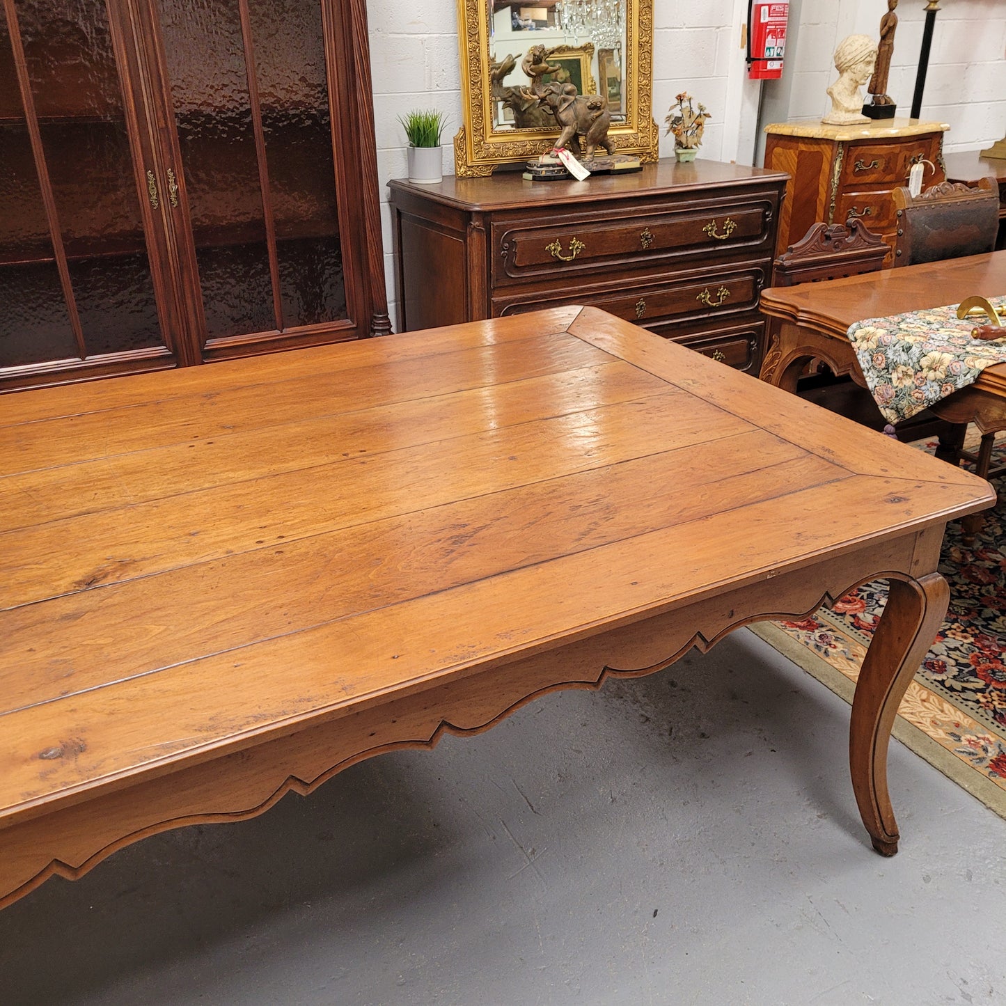 Rustic 19th Century French Fruitwood Parisian farmhouse dining table. Sourced from France this amazing hard to find size table can easily sit 12 to 14 people. It is good original detailed condition. Please see photos as they form part of the descript