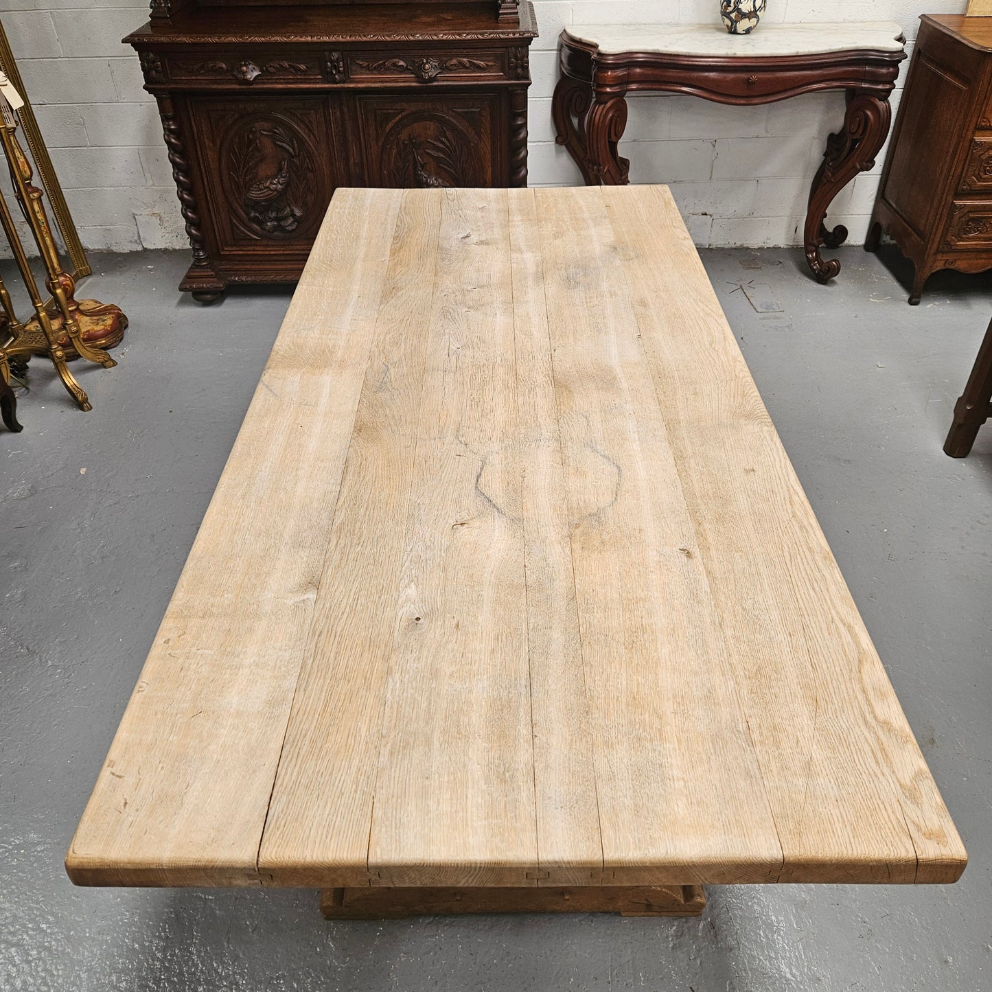 Sourced from France a raw French Oak pedestal dining table. This stunning table features raw oak timber that could be used as is for a distressed look, or finished and waxed for a more refined look. It is in good solid original condition.