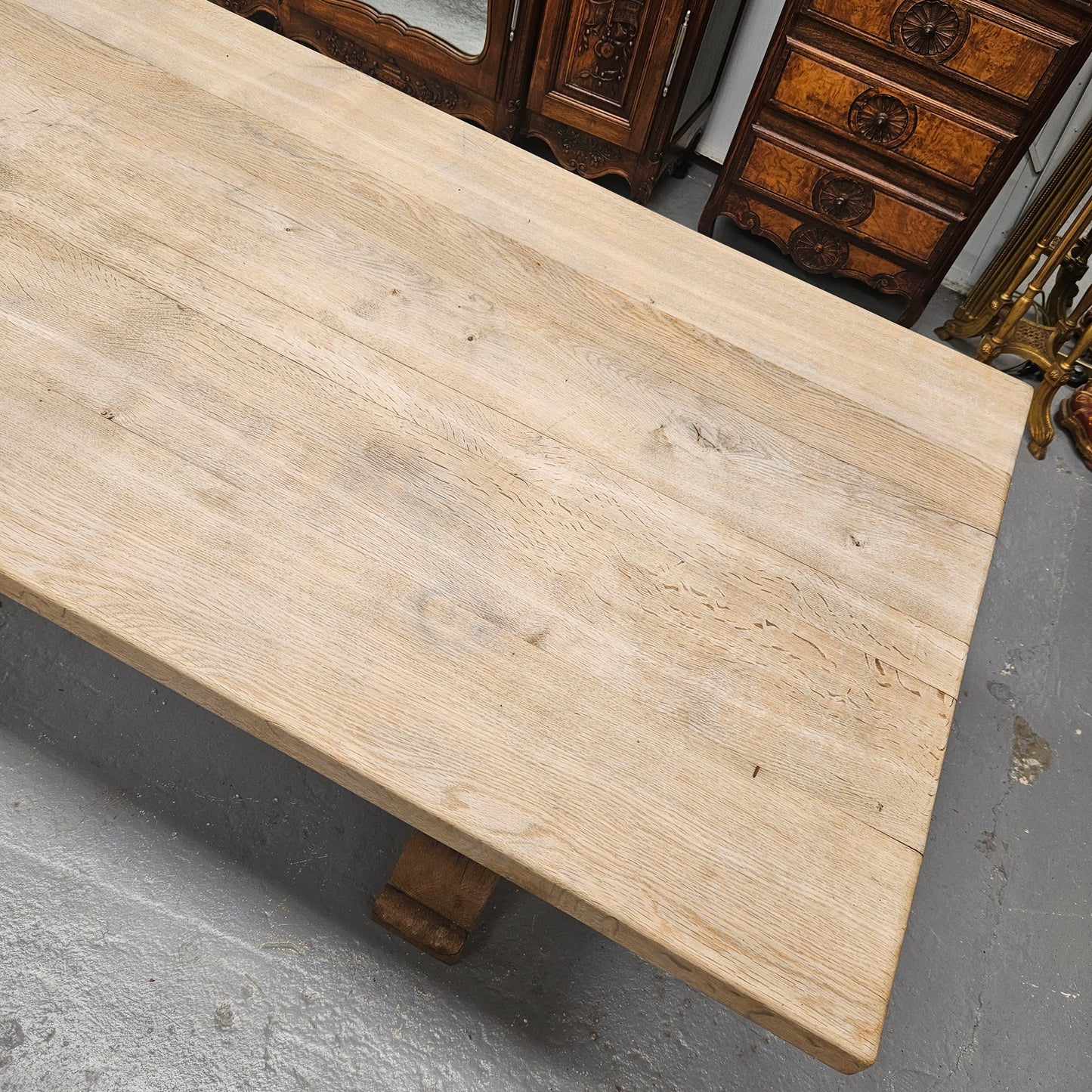 Sourced from France a raw French Oak pedestal dining table. This stunning table features raw oak timber that could be used as is for a distressed look, or finished and waxed for a more refined look. It is in good solid original condition.