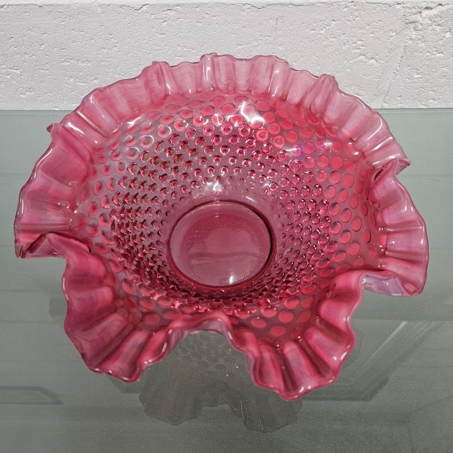 Vintage Large Fenton Cranberry glass bowl with opalescent trim. In good condition. Please see photos as they form part of the description.