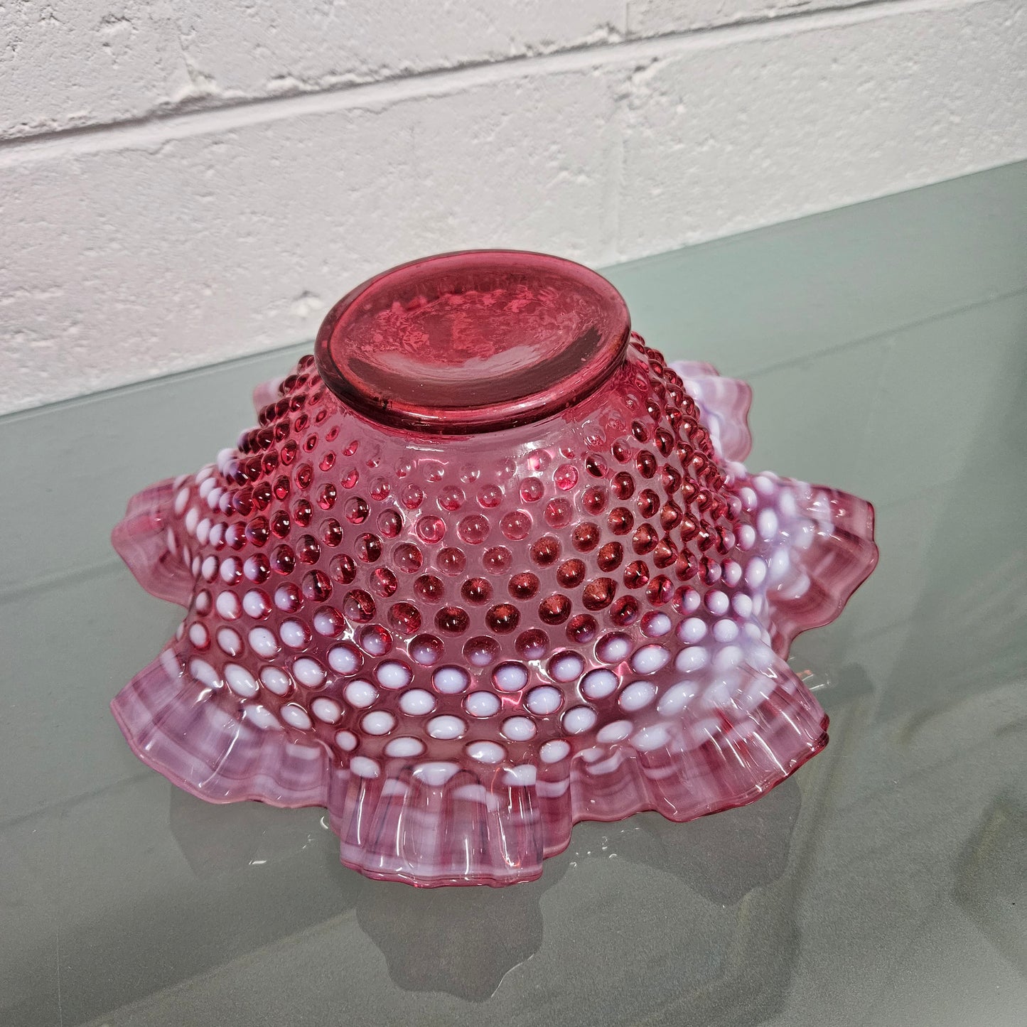 Vintage Large Fenton Cranberry glass bowl with opalescent trim. In good condition. Please see photos as they form part of the description.