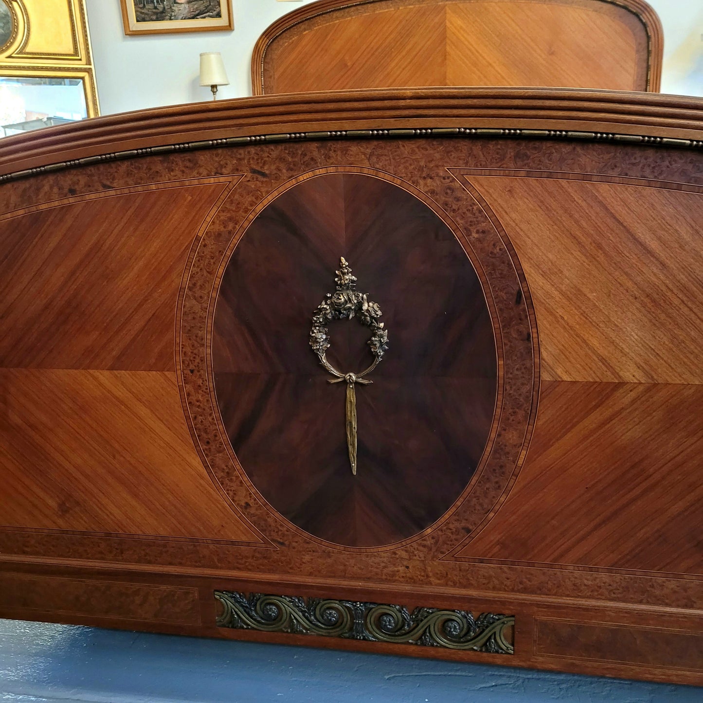 This elegant French Art Deco Walnut & Burr Walnut queen-size bed showcases stunning bronze mounts and impeccable craftsmanship. Its custom-made slats ensure a comfortable and supportive rest, while the ease of assembly and disassembly adds to its practicality. Sourced directly from France, it has been detailed and is in good condition.