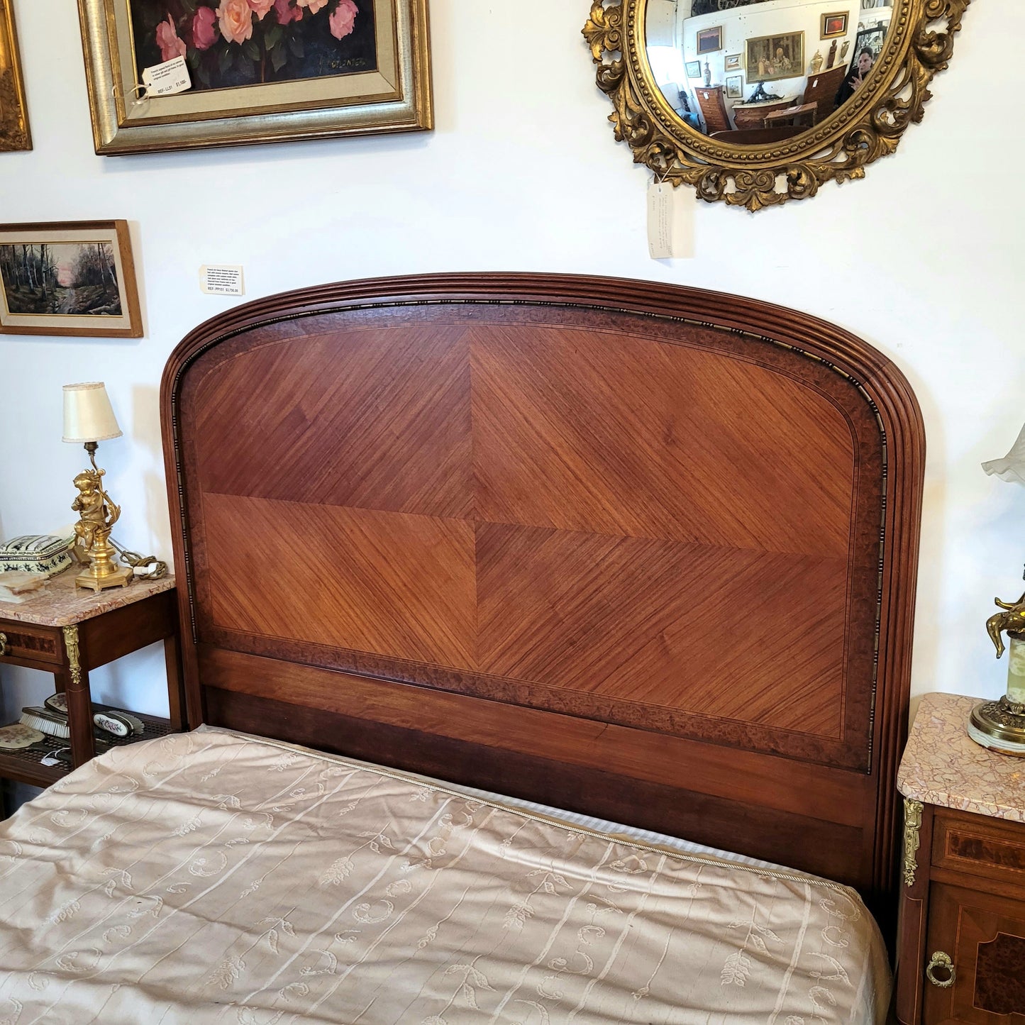 This elegant French Art Deco Walnut & Burr Walnut queen-size bed showcases stunning bronze mounts and impeccable craftsmanship. Its custom-made slats ensure a comfortable and supportive rest, while the ease of assembly and disassembly adds to its practicality. Sourced directly from France, it has been detailed and is in good condition.