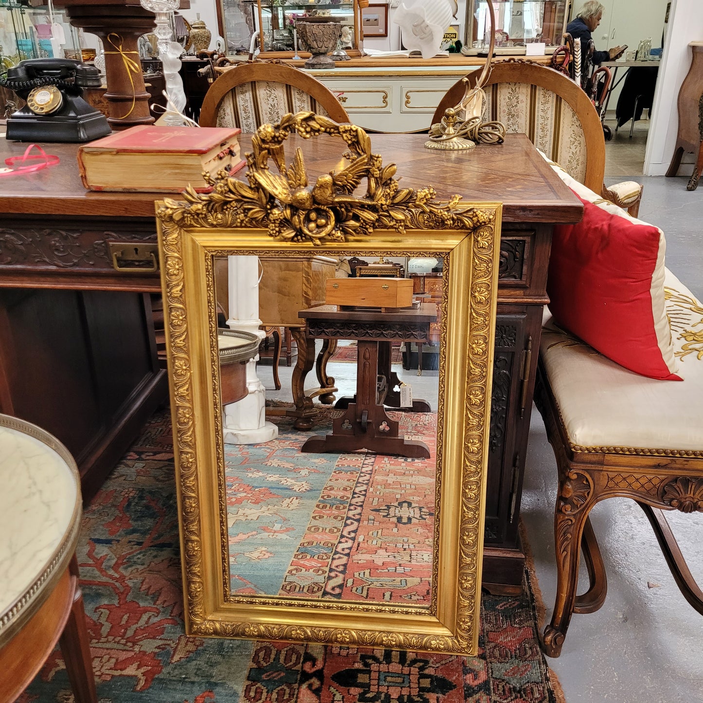 Compact Late 19th Century French Gilt Framed Wall Mirror Featuring Carved Birds