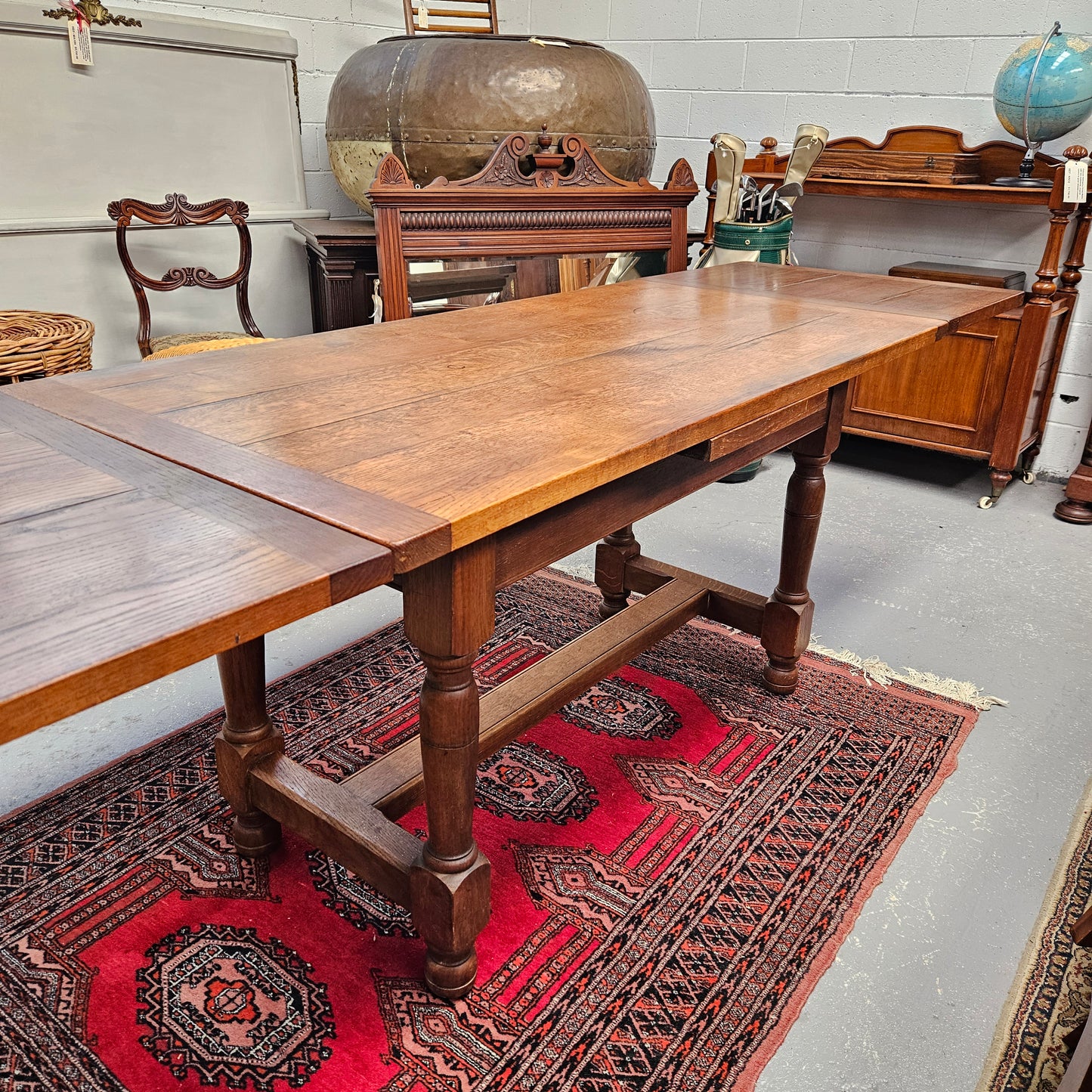 Rare and unique sized French Oak stretcher base extension dining table. Fully extended length is 253 cm, this table is in great original condition. Sourced from France. Please see photos as they form part of the description.
