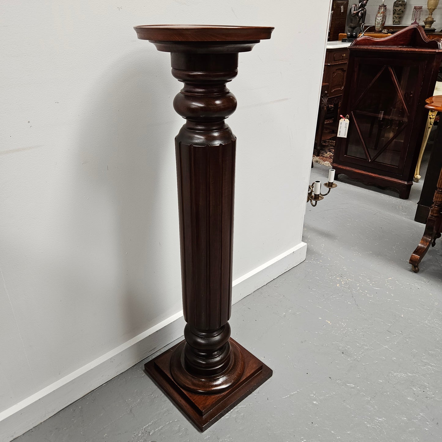 Amazing blackwood gun barrel pedestal with a great design. It is in good original condition. Please see photos as they form part of the description.