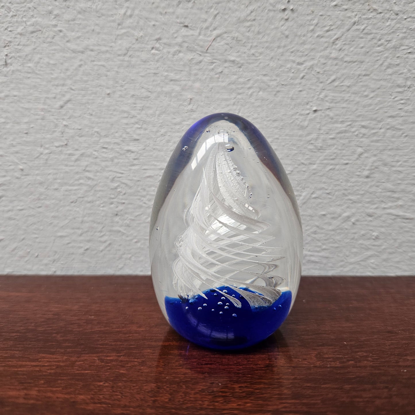 Attractive blue base, white swirl signed paperweight. In good condition. Please see photos as they form part of the description.