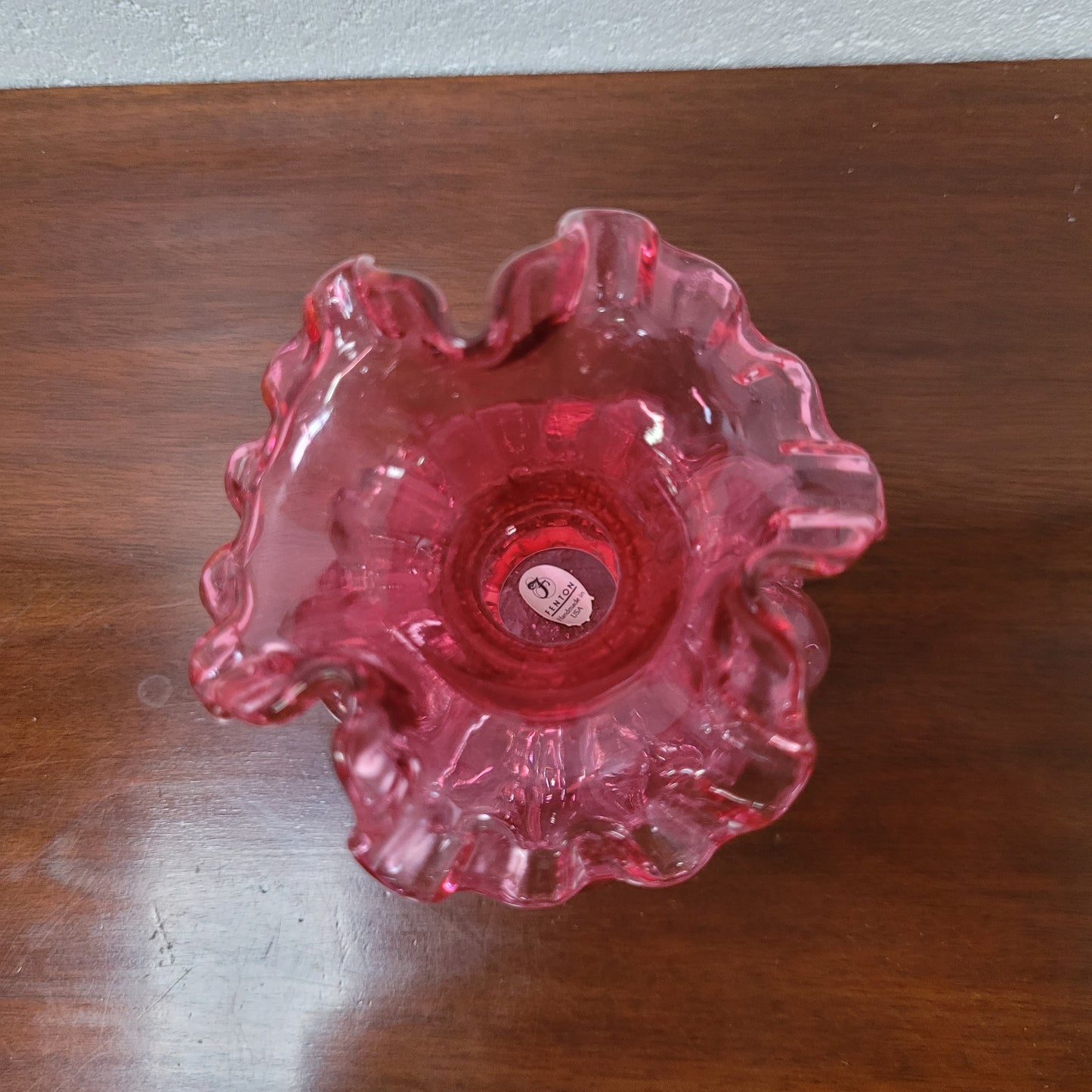 Very attractive Fenton cranberry red glass vase in the melon shape with beading between each segment and and a lovely frilled top. In excellent condition.