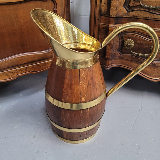 Stunning French Oak and brass jug which could be used as an umbrella stand. It has been sourced from France and is in good original detailed condition. Circa 1950's.