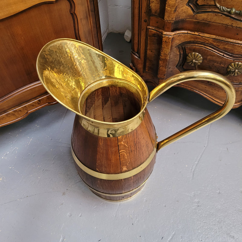 Stunning French Oak and brass jug which could be used as an umbrella stand. It has been sourced from France and is in good original detailed condition. Circa 1950's.