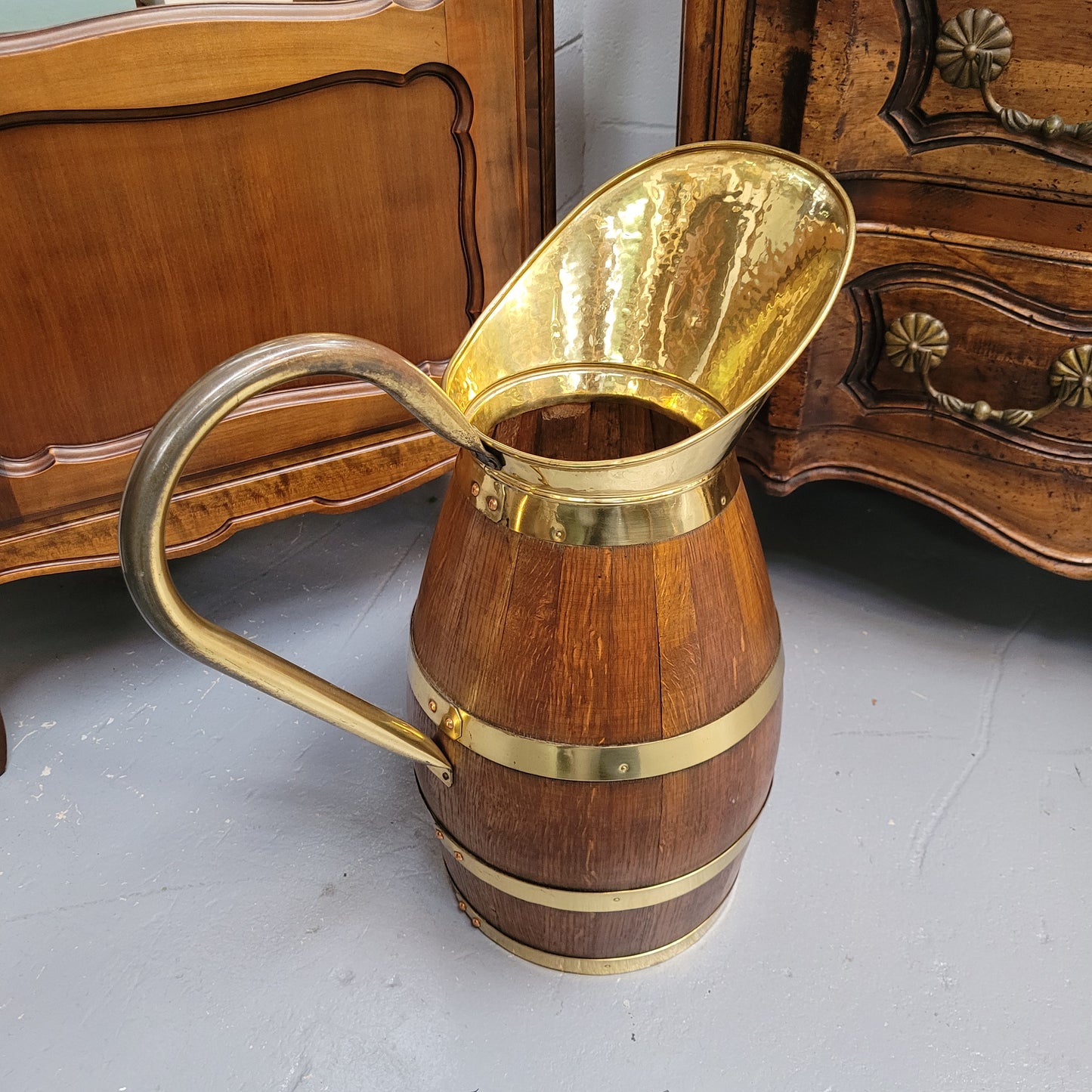 Stunning French Oak and brass jug which could be used as an umbrella stand. It has been sourced from France and is in good original detailed condition. Circa 1950's.