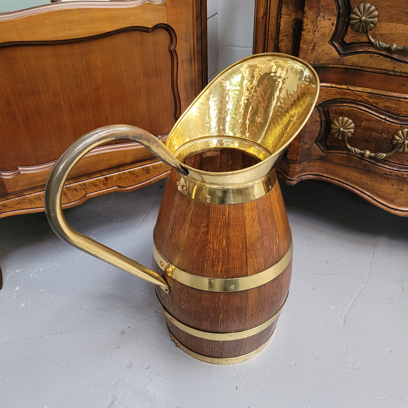 Stunning French Oak and brass jug which could be used as an umbrella stand. It has been sourced from France and is in good original detailed condition. Circa 1950's.