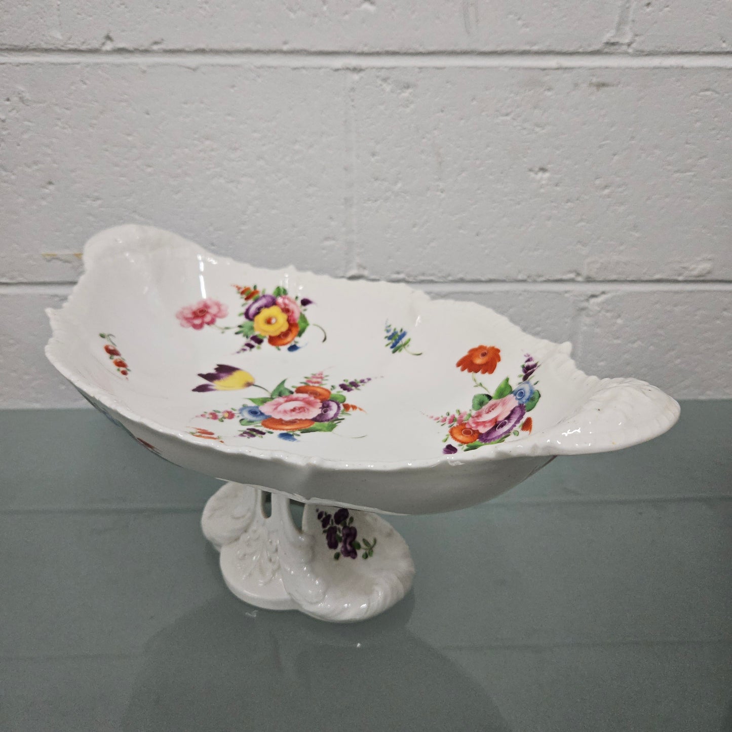Lovely antique Coalport comport with a floral design 1830's , it is in good original condition with some faults under the bowl during the making.