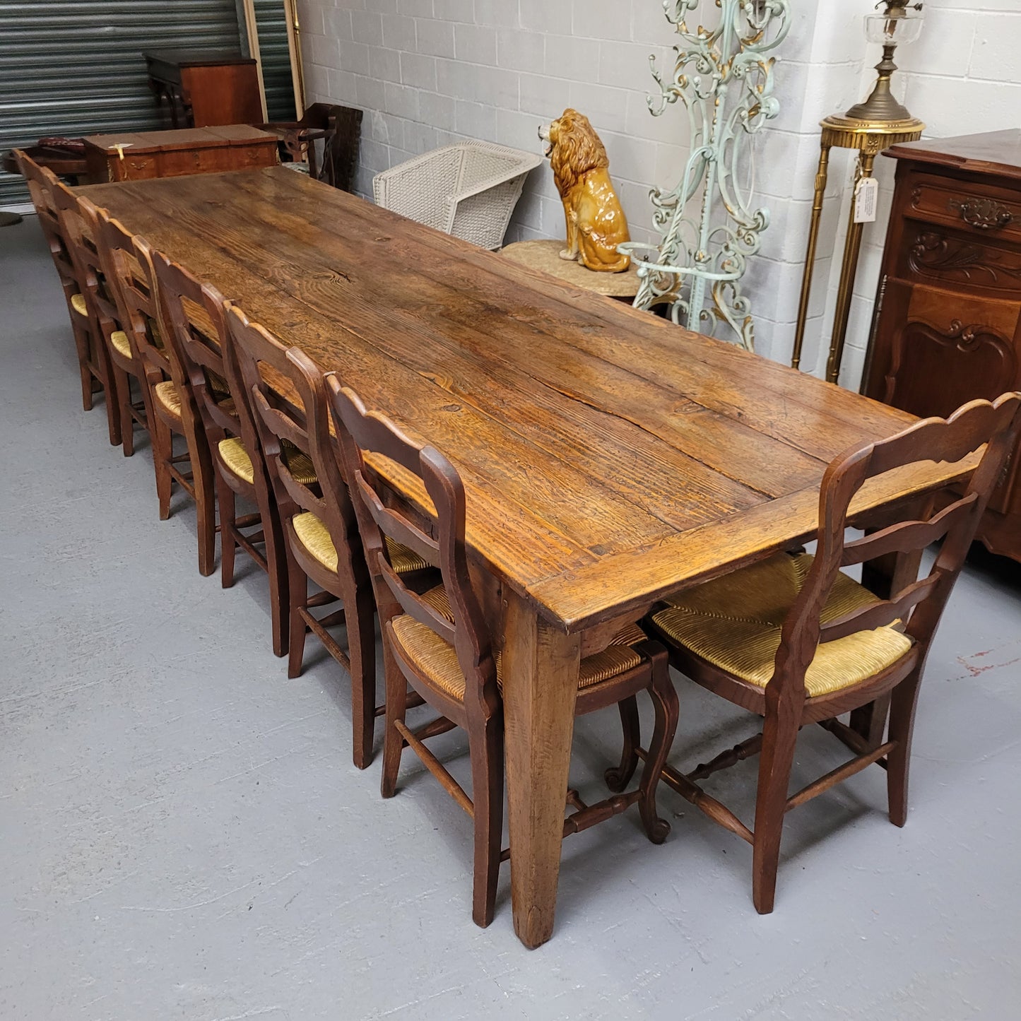 Experience the charm of our vintage reclaimed antique Spruce Pine timber farmhouse dining table, measuring 3.3 meters in length. Restored to its former glory, this table boasts sturdy construction with added central leg support for enhanced stability. This timeless piece exudes character and can comfortably accommodate up to 14 guests, making it a must-have centerpiece for your dining space.