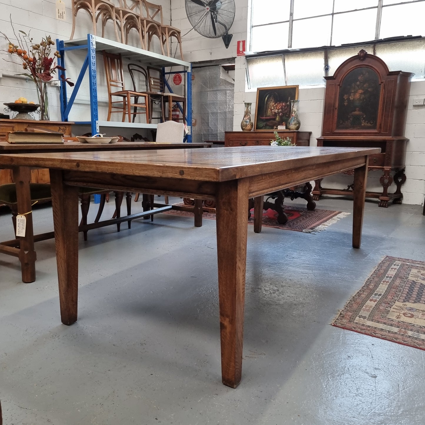 Vintage reclaimed French Oak farmhouse style dining table. It is 1 meter wide and 2.5 meters long this charming table comfortably seats 10. Made from thick Oak timber planks, It is in good original detailed condition.