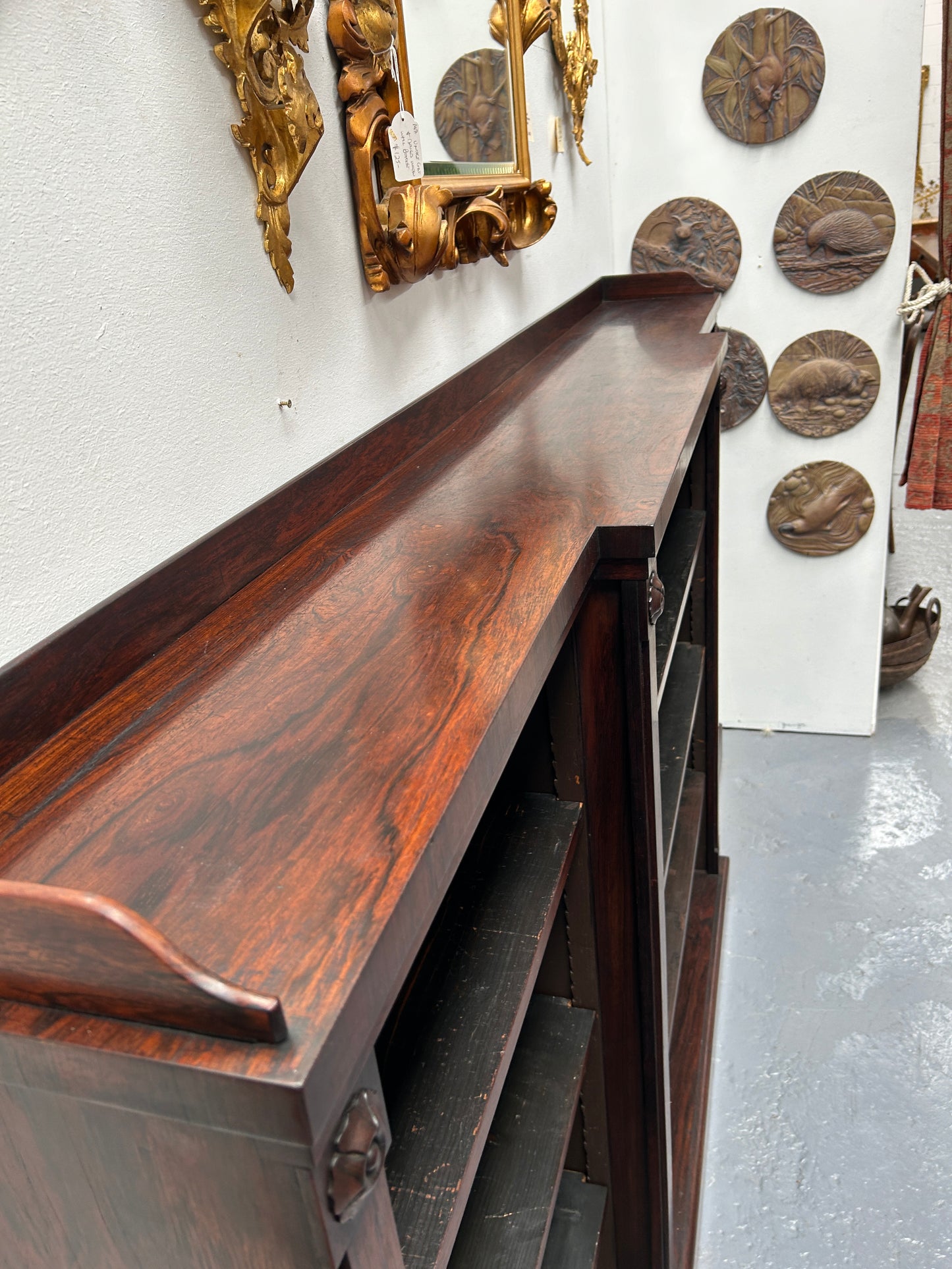 A very functional and highly desirable Rosewood Antique early 19th century free-standing breakfront bookcase. Shelves are adjustable, and trim is in great detailed condition.