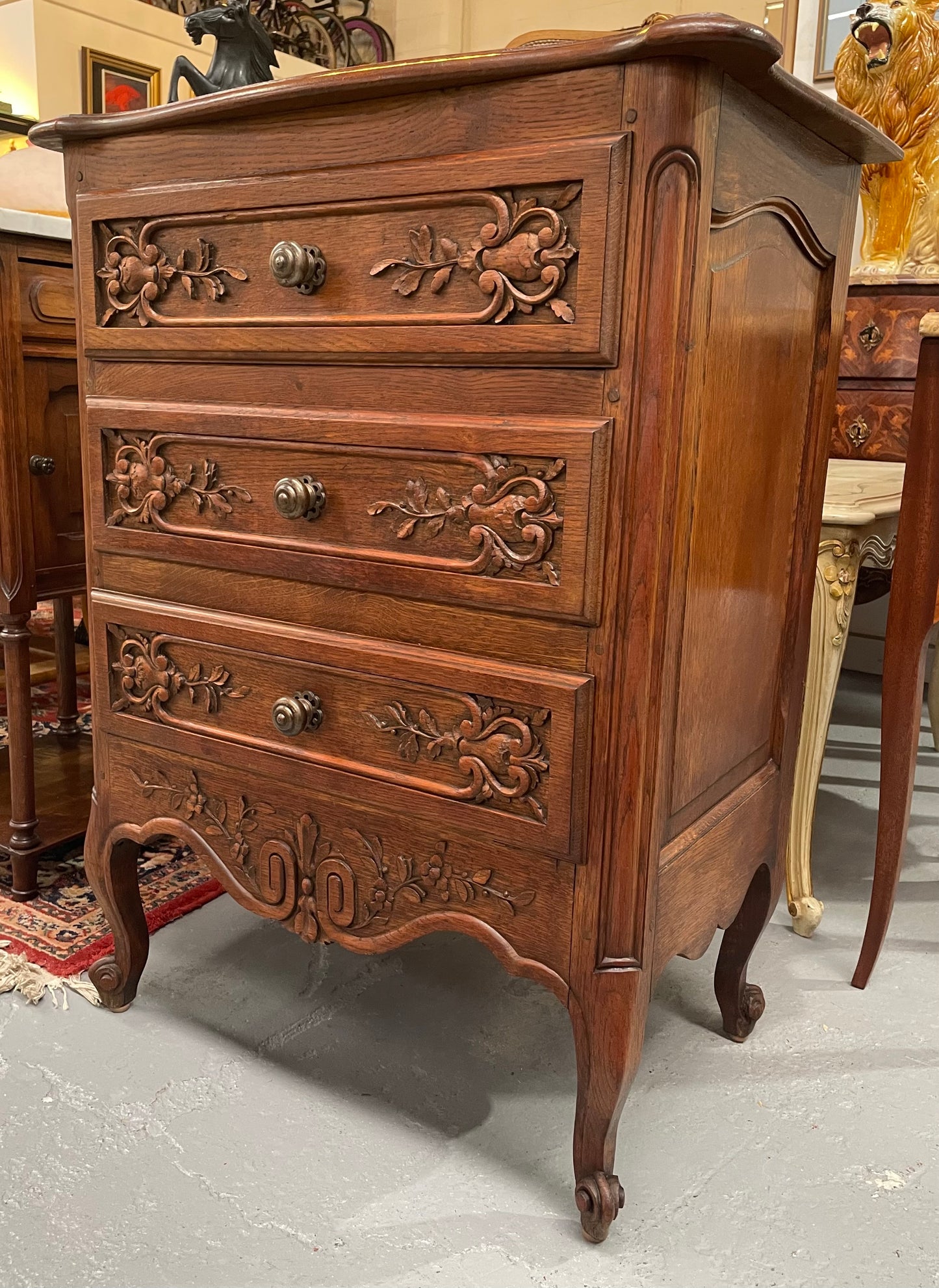 Beautiful French oak Louis XV style carved chest of three drawers with lovely details and in good original detailed condition. Sourced from France.
