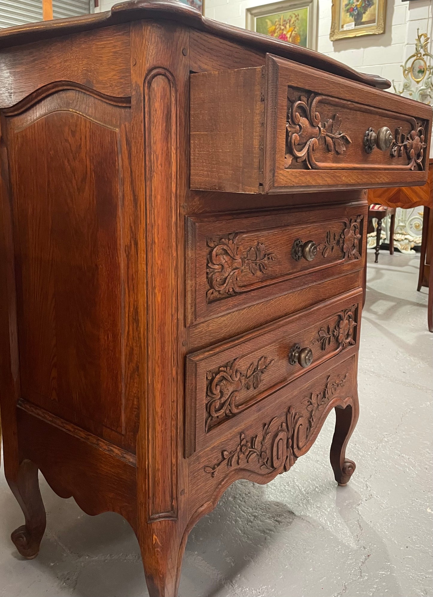 Beautiful French oak Louis XV style carved chest of three drawers with lovely details and in good original detailed condition. Sourced from France.