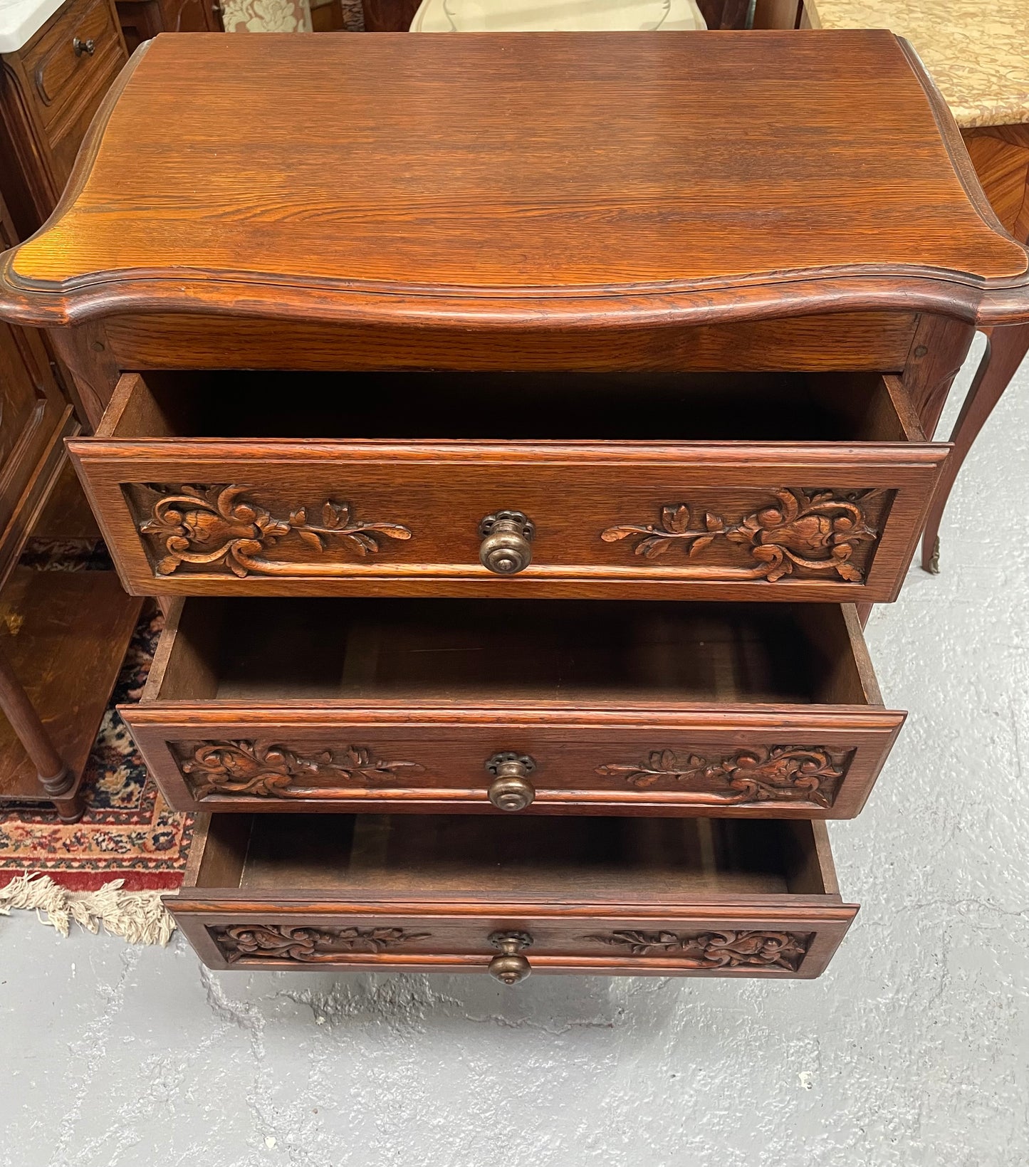 Beautiful French oak Louis XV style carved chest of three drawers with lovely details and in good original detailed condition. Sourced from France.