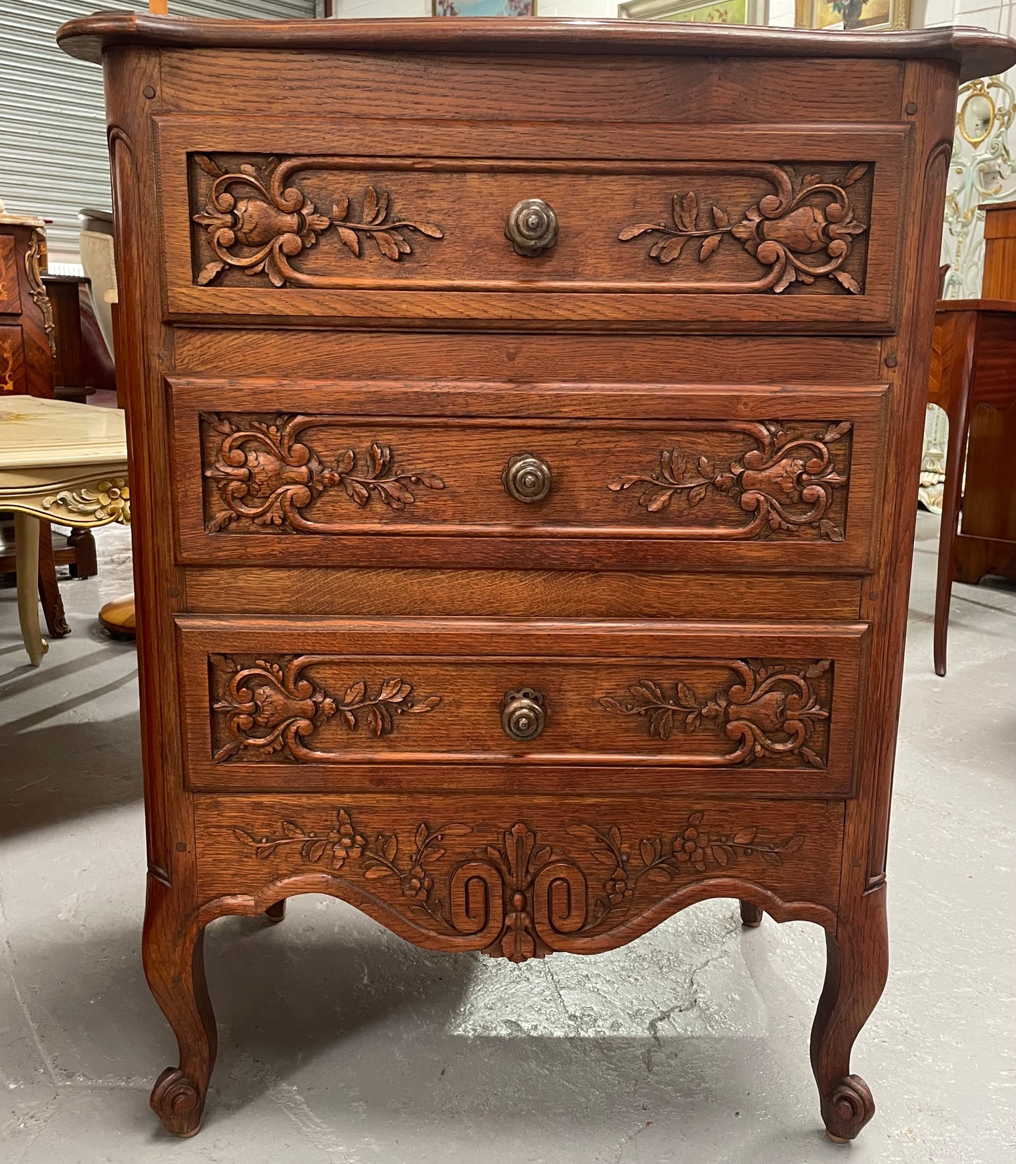 Beautiful French oak Louis XV style carved chest of three drawers with lovely details and in good original detailed condition. Sourced from France.